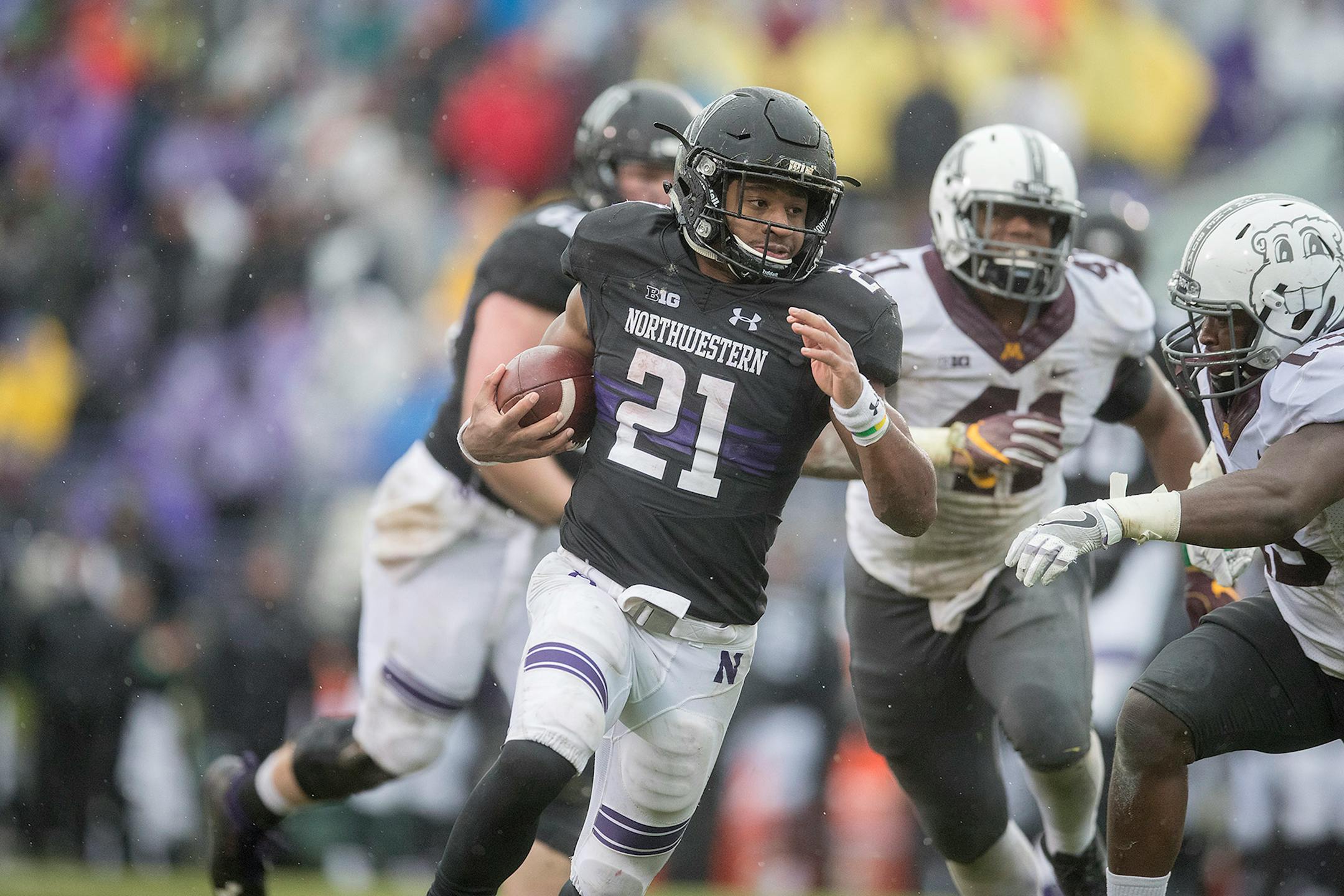 Northwestern running back Justin Jackson ran with the ball for a first down during the second quarter against Minnesota