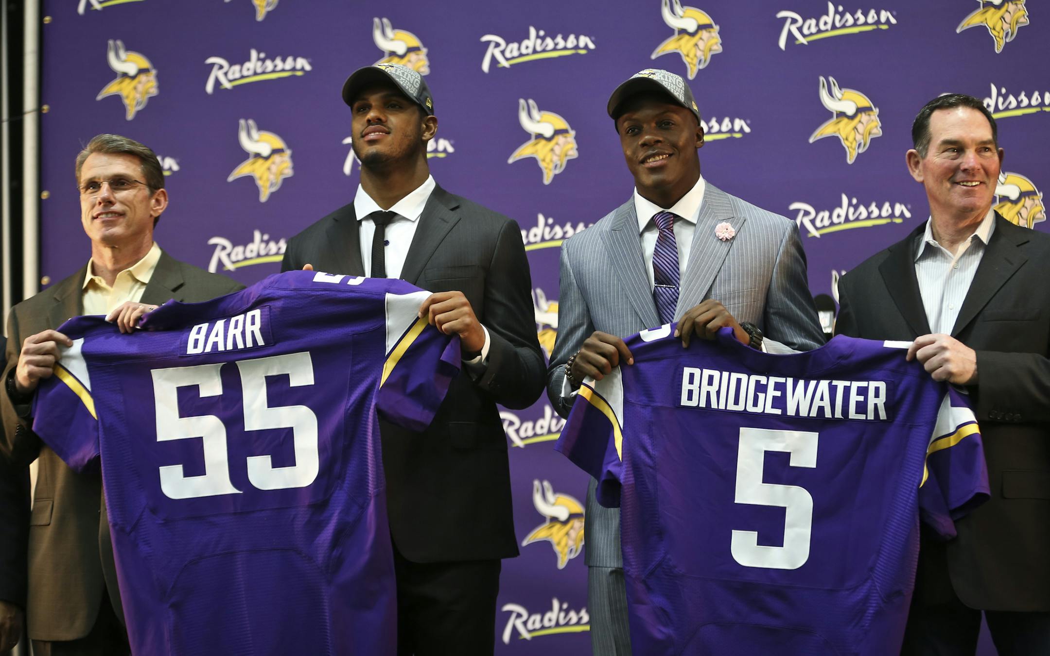 Vikings GM Rick Spielman (left) and head coach Mike Zimmer (right) stood with first round draft choices Anthony Barr and Teddy Bridgewater during a press conference on Friday, May 9, 2014 at Winter Park in Eden Prairie, Minn. ] RENEE JONES SCHNEIDER • reneejones@startribune.com ORG XMIT: MIN1405091652317255