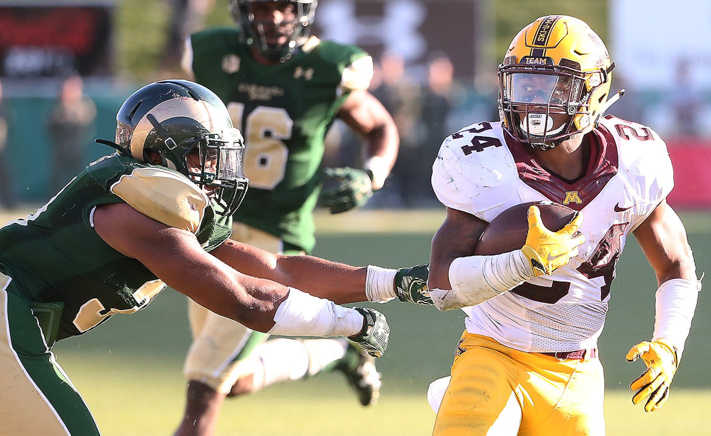 Minnesota running back Rodney Smith ran the ball despite defensive pressure by Colorado State linebacker Cory James in overtime as Minnesota took on Colorado State at Sonny Lubick Field at Hughes Stadium, Saturday, September 12, 2015 in Ft. Collins, CO. ] (ELIZABETH FLORES/STAR TRIBUNE) ELIZABETH FLORES &#xef; eflores@startribune.com