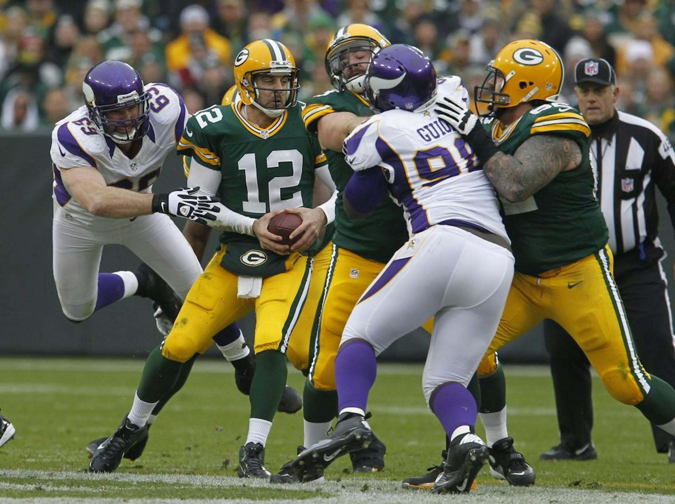 Packers QB Aaron Rodgers (12) isn't completely blitz-proof, but he makes teams pay when they do. The Vikings must reach him mostly with their front four Sunday.