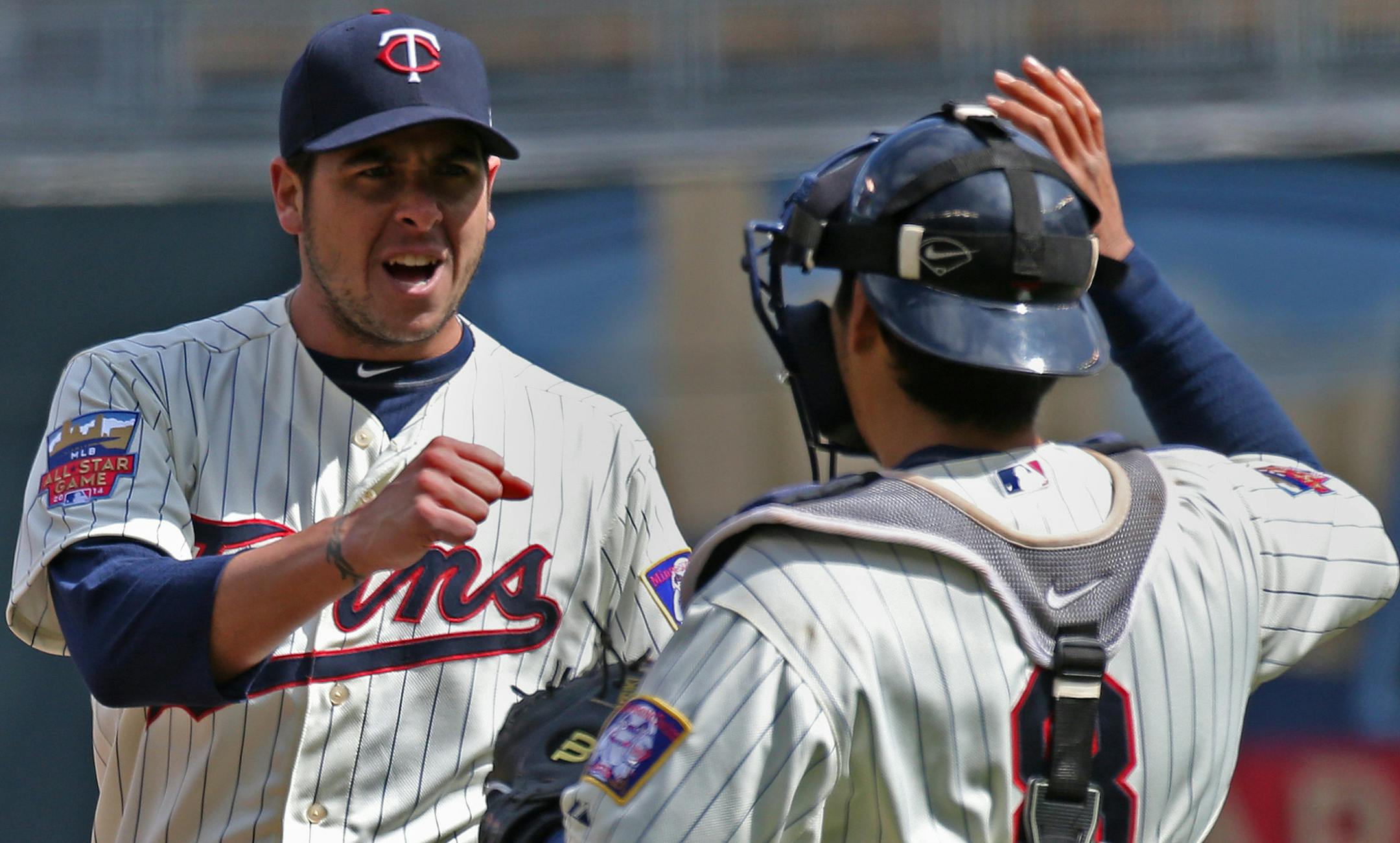 Minnesota Twins pitcher Anthony Swarzak and catcher Kurt Suzuki.