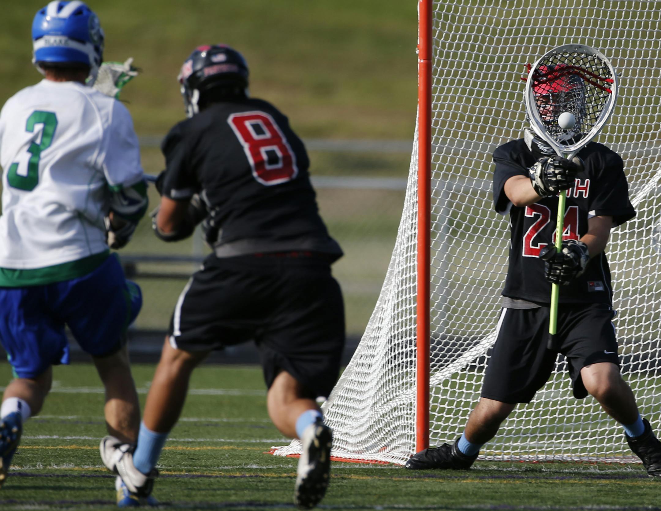 At Chaska H.S. in a quarterfinal playoff game between Blake and Lakeville North, Lakeville North Goalie Bryce Bouman(24) makes a save .]richard.tsong-taatarii/rtsong-taatarii@startribune.com