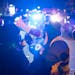 A community member sought to deescalate the dialog between angry community members and police at the perimeter around the Holiday gas station where th