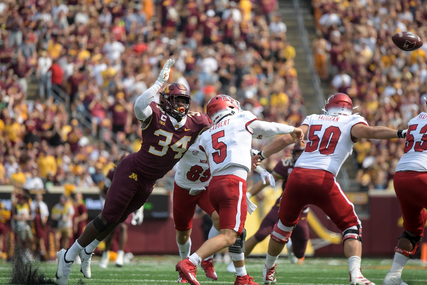 Minnesota Gophers defensive lineman Boye Mafe (34) attempted to tackle Miami (Oh) Redhawks quarterback Brett Gabbert (5) as he released the ball in the second quarter. ] AARON LAVINSKY • aaron.lavinsky@startribune.com