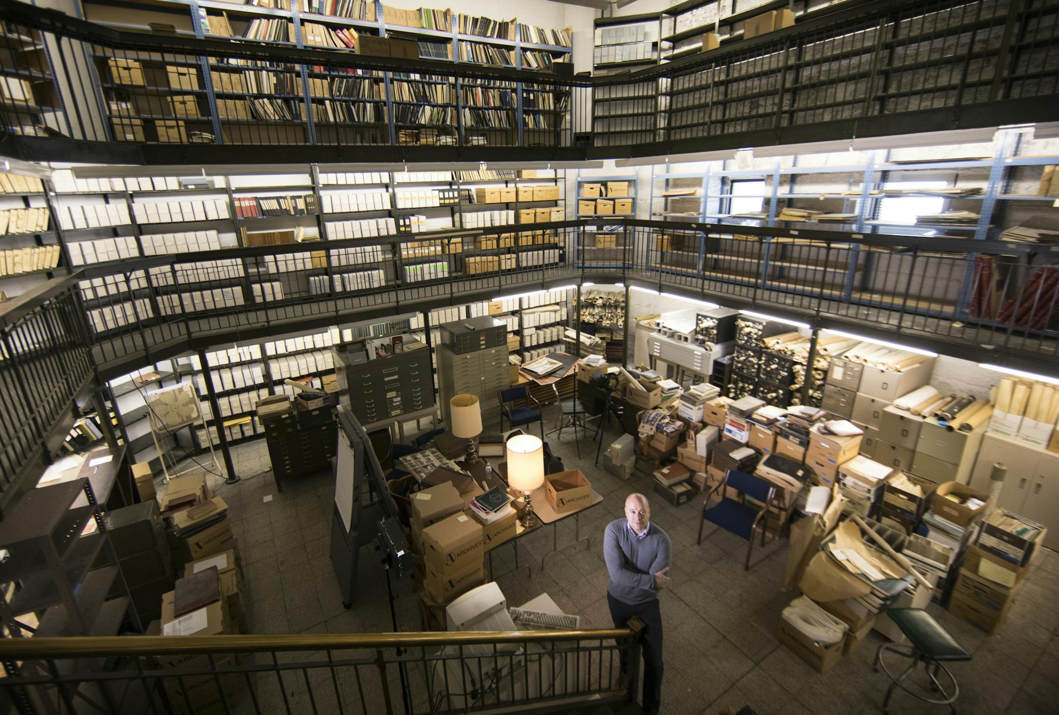 Minneapolis city records manager Josh Schaffer poses inside the Minneapolis City Archives. ] (Leila Navidi/Star Tribune) leila.navidi@startribune.com BACKGROUND INFORMATION: The Minneapolis City Archives inside the City Hall building in the downtown Minneapolis on Friday, January 6, 2017. The Minneapolis City Archives are an historian's dream, overseen by a small city staff committed to record preservation that relies on volunteer help in an effort to sort through the papers and files and digiti