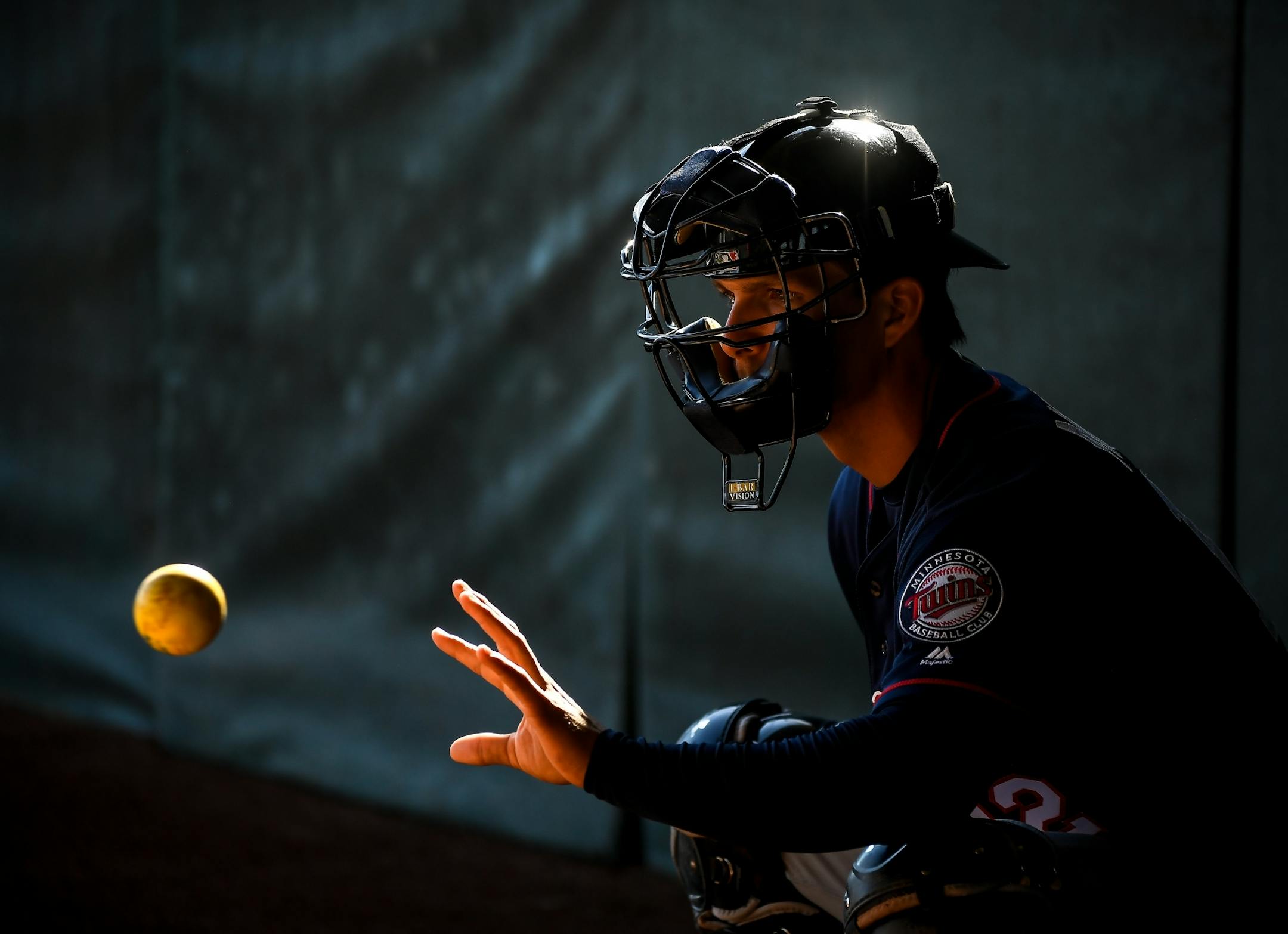 Minnesota Twins catcher John Ryan Murphy (12) caught a ball barehanded during catcher drills Monday morning.