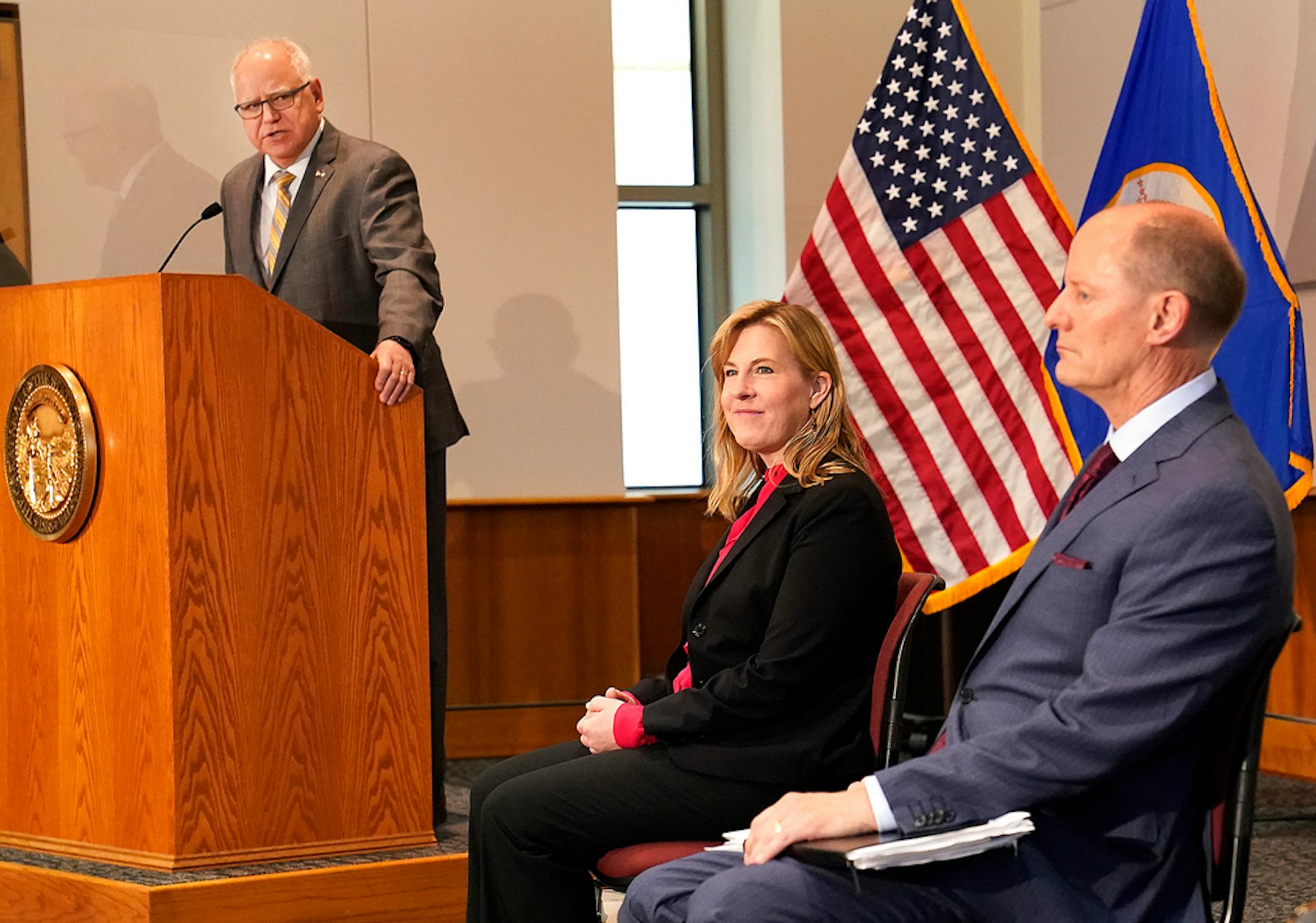 Gov. Tim Walz spoke as the podium and Senate Majority Leader Paul Gazelka, R-East Gull Lake, right to left, and