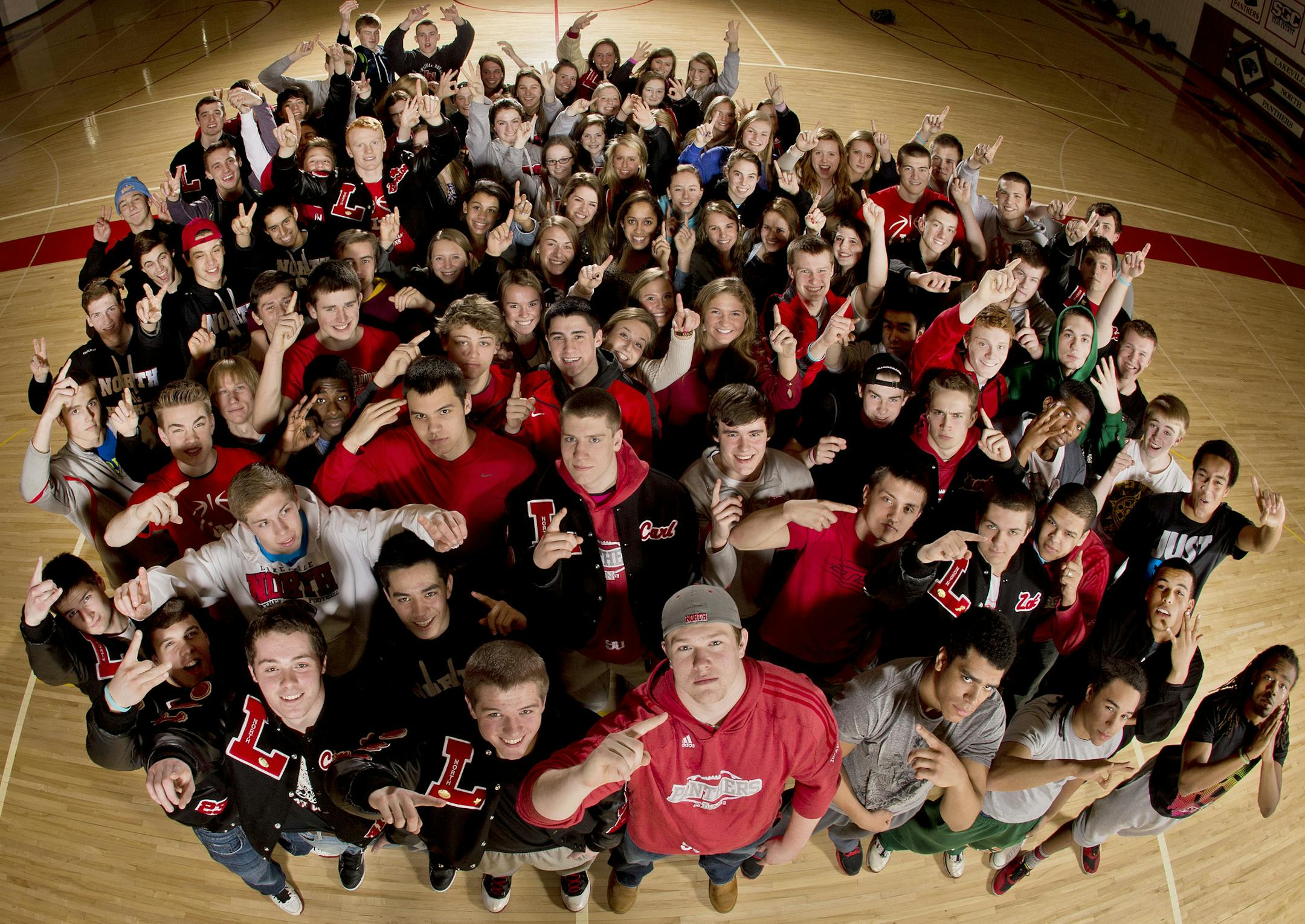 Smile and say "State!": Lakeville North athletes from five of the school's state tournament teams (boys and girls) in football, hockey and basketball gathered for a group photo.