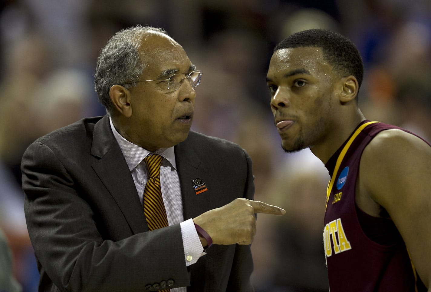 Gophers men's basketball coach Tubby Smith spoke with point guard Andre Hollins during Sunday's game against Florida in the third round of the NCAA basketball tournament. Smith was fired on Monday.