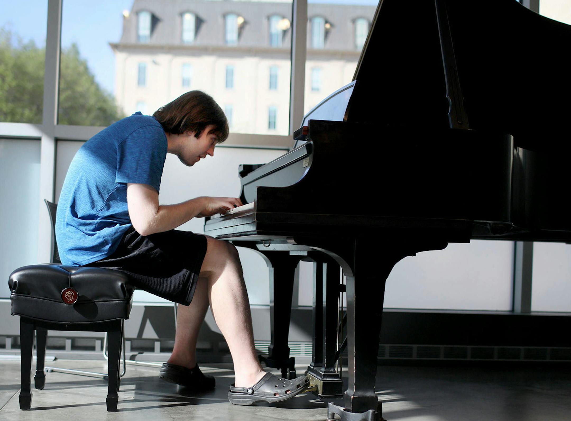 Alex Hagen, 21, has severe autism and limited speaking skills. But since he was a child, Hagen has displayed an amazing talent for playing the piano -- including a rare ability to play complicated classical pieces without reading the musical notes. With the help of state vocational counselors, Hagen is looking for work as a pianist. They have helped him develop a "video resume" of his musical work. Here, Hagen played piano during a lesson at MacPhail Center for Music Tuesday, May 15, 2018, in Mi