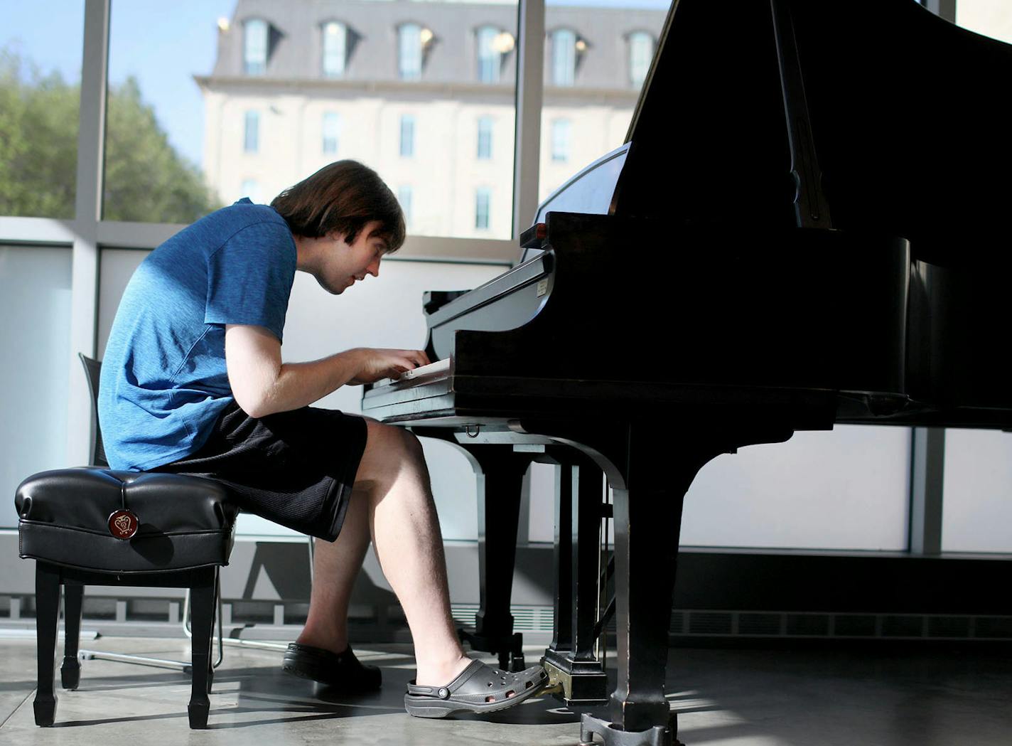 Alex Hagen, 21, has severe autism and limited speaking skills. But since he was a child, Hagen has displayed an amazing talent for playing the piano -- including a rare ability to play complicated classical pieces without reading the musical notes. With the help of state vocational counselors, Hagen is looking for work as a pianist. They have helped him develop a "video resume" of his musical work. Here, Hagen played piano during a lesson at MacPhail Center for Music Tuesday, May 15, 2018, in Mi