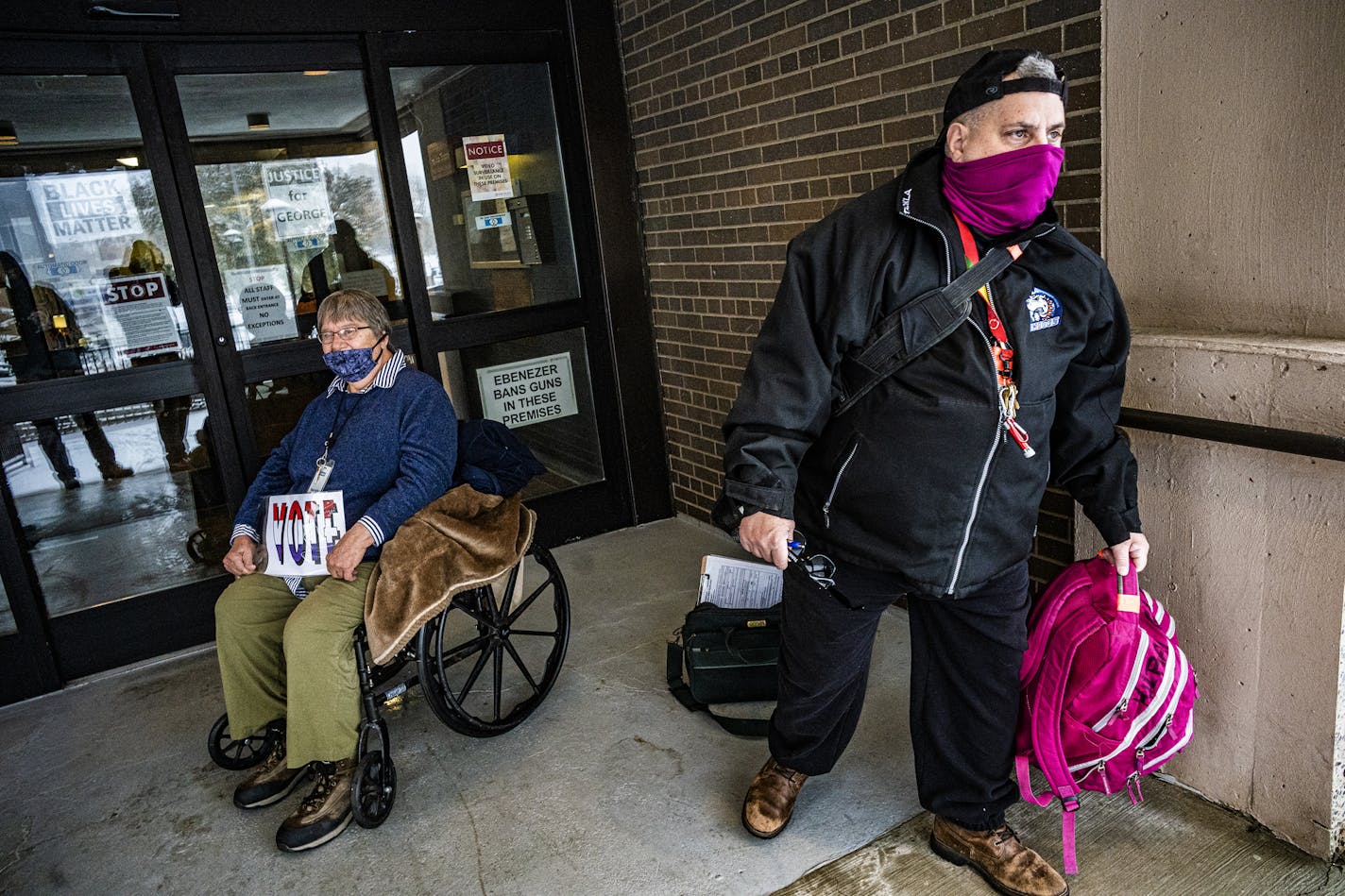 Kilray Beaumont, 59, gets ready to head off and drop off absentee ballot requests as well early voting ballots at the Minneapolis Early Vote Center. In the background is Anne Bobreski who helped him in his efforts to help seniors vote.] RICHARD TSONG-TAATARII ¥ richard.tsong-taatarii@startribune.com