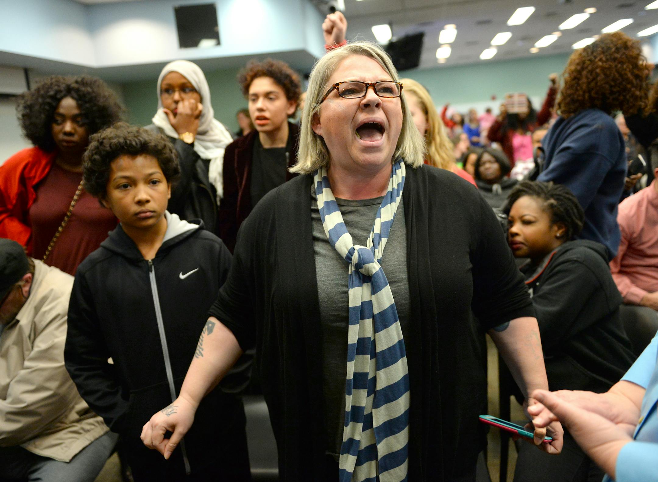 Susan Montgomery and her 11-year-old son, Taye Clinton, left, interrupted the St. Paul School Board meeting Tuesday night during a demonstration. ] (AARON LAVINSKY/STAR TRIBUNE) aaron.lavinsky@startribune.com As the St. Paul school board gets set to vote Tuesday on a teachers contract containing new school-safety provisions, the district reports that assaults on staff members are up from a year ago. In fact, the 44 assaults reported to the district's emergency call center already exceed the 41 r