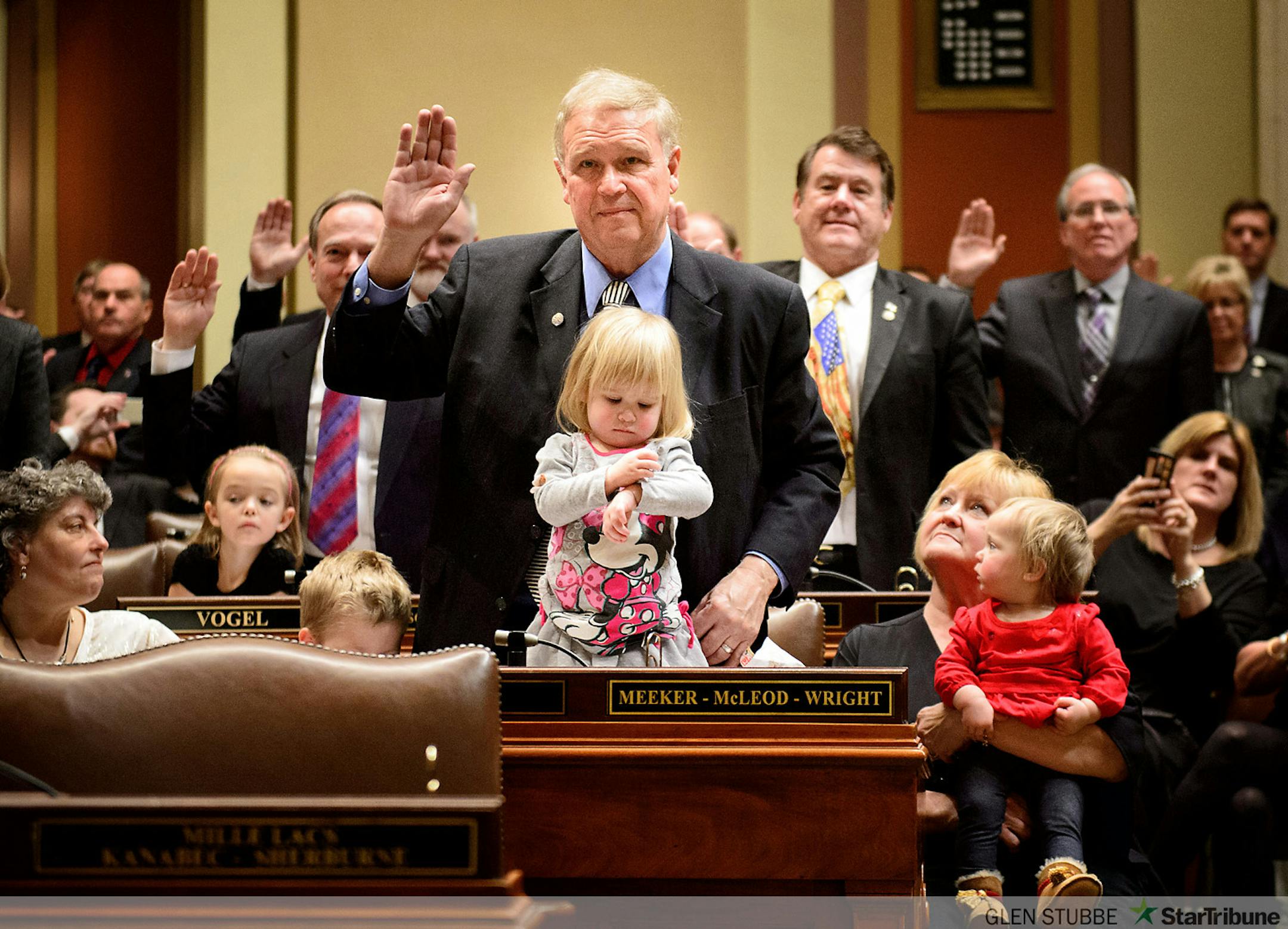 Rep. Dean Urdahl was among the House members sworn in with his grandchildren Mason, seated, Bernadette, 2 and Veronica, 1, held by Karen Urdahl, Dean's wife.      ]   GLEN STUBBE * gstubbe@startribune.com   Tuesday, January 6,  2015  The Minnesota House and Senate re-convene, with much ceremony, family and guests. In the House, Speaker Kurt Daudt will take the gavel back for the GOP.