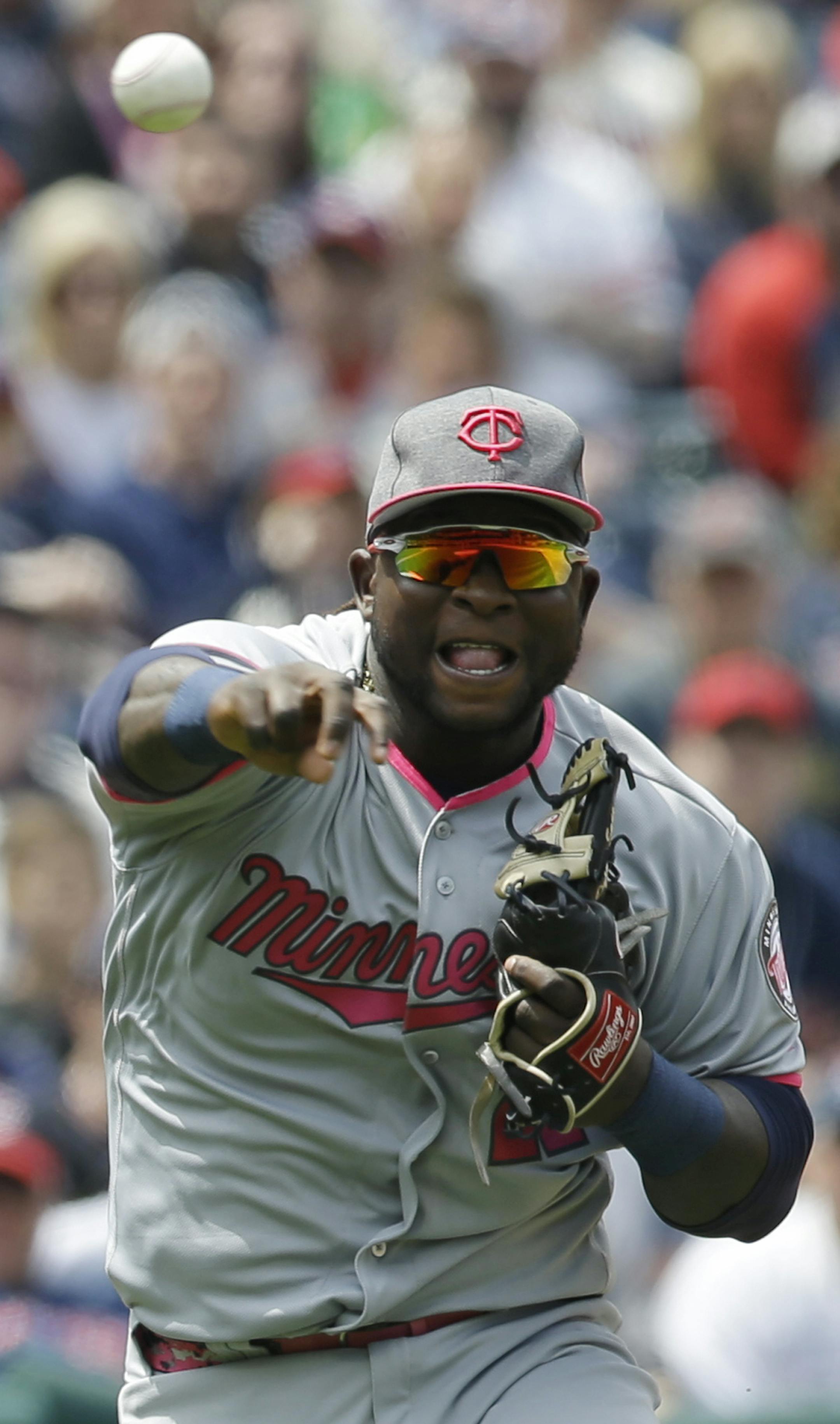 Minnesota Twins' Miguel Sano throws out Cleveland Indians' Daniel Robertson at first base in the third inning of a baseball game, Sunday, May 14, 2017, in Cleveland. (AP Photo/Tony Dejak)