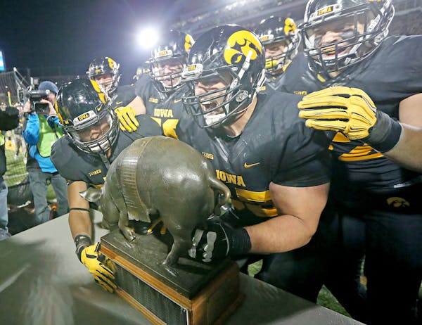 "Floyd of Rosedale" made it back into the hands of Iowa players after they defeated Minnesota 40-35 at Kinnick Stadium, Saturday, November 14, 2015 in