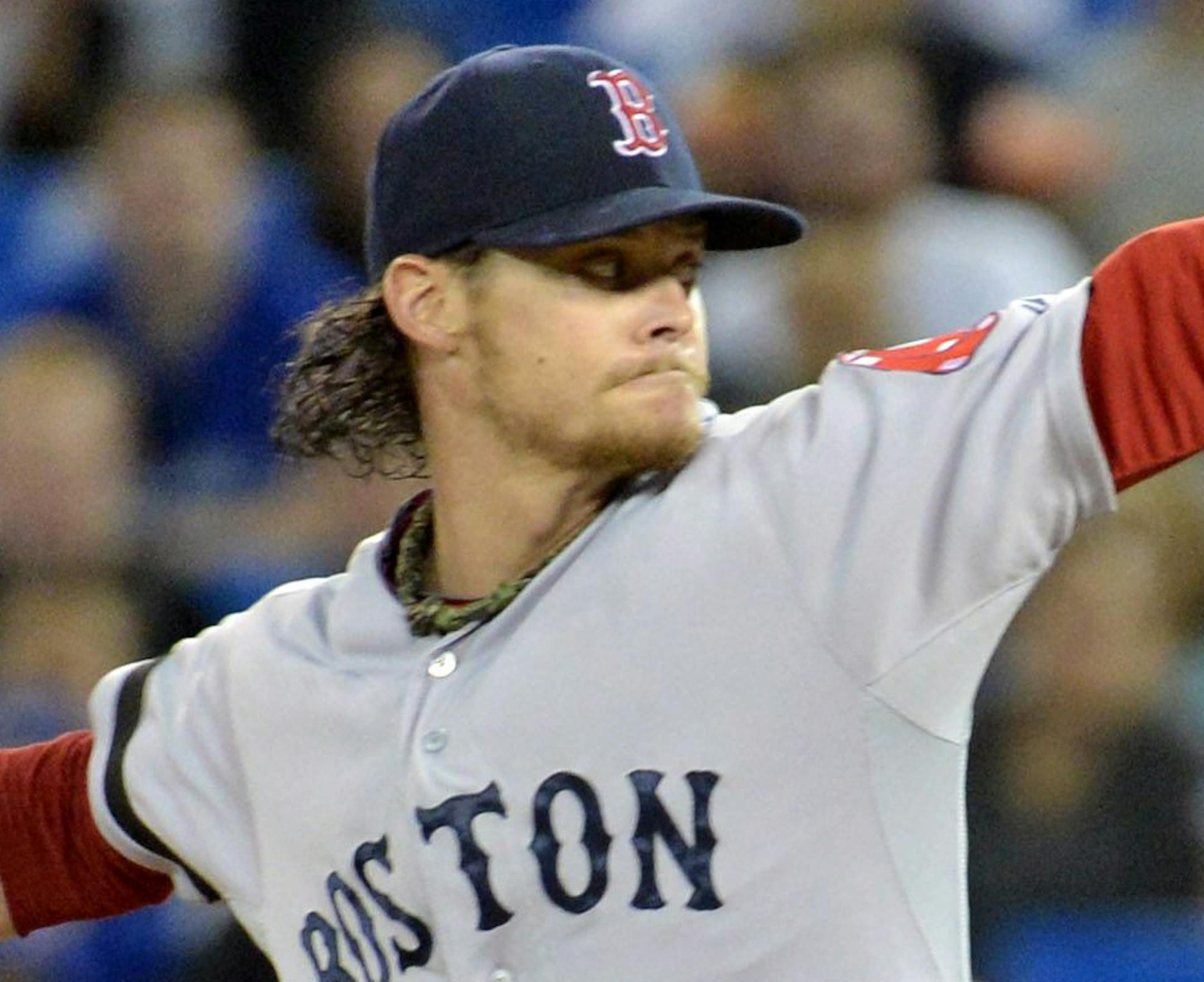 Boston Red Sox starting pitcher Clay Buchholz throws against the Toronto Blue Jays during the first inning of their baseball game, Wednesday, May 1, 2013, in Toronto. (AP Photo/The Canadian Press, Nathan Denette)