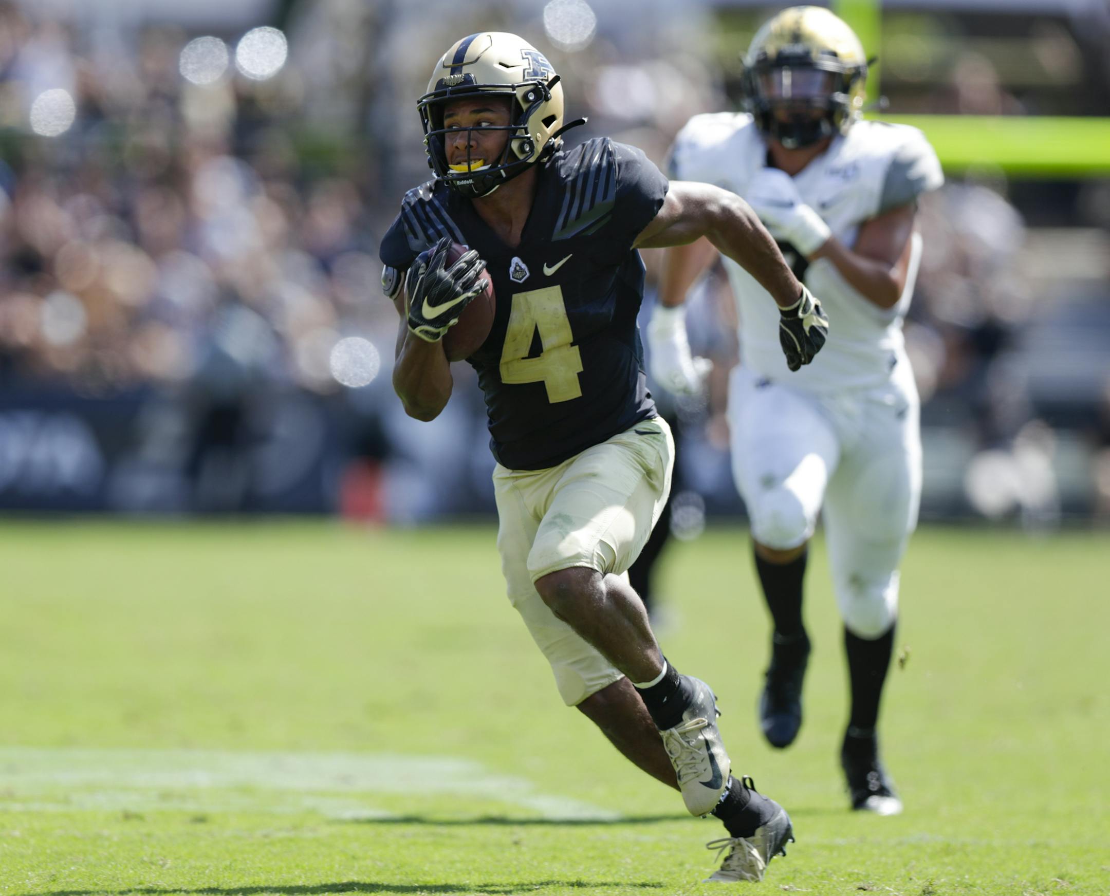 Purdue wide receiver Rondale Moore (4) runs after a catch against Vanderbilt during the second half of an NCAA college football game in West Lafayette, Ind., Saturday, Sept. 7, 2019. Purdue defeated Vanderbilt 42-24. (AP Photo/Michael Conroy)