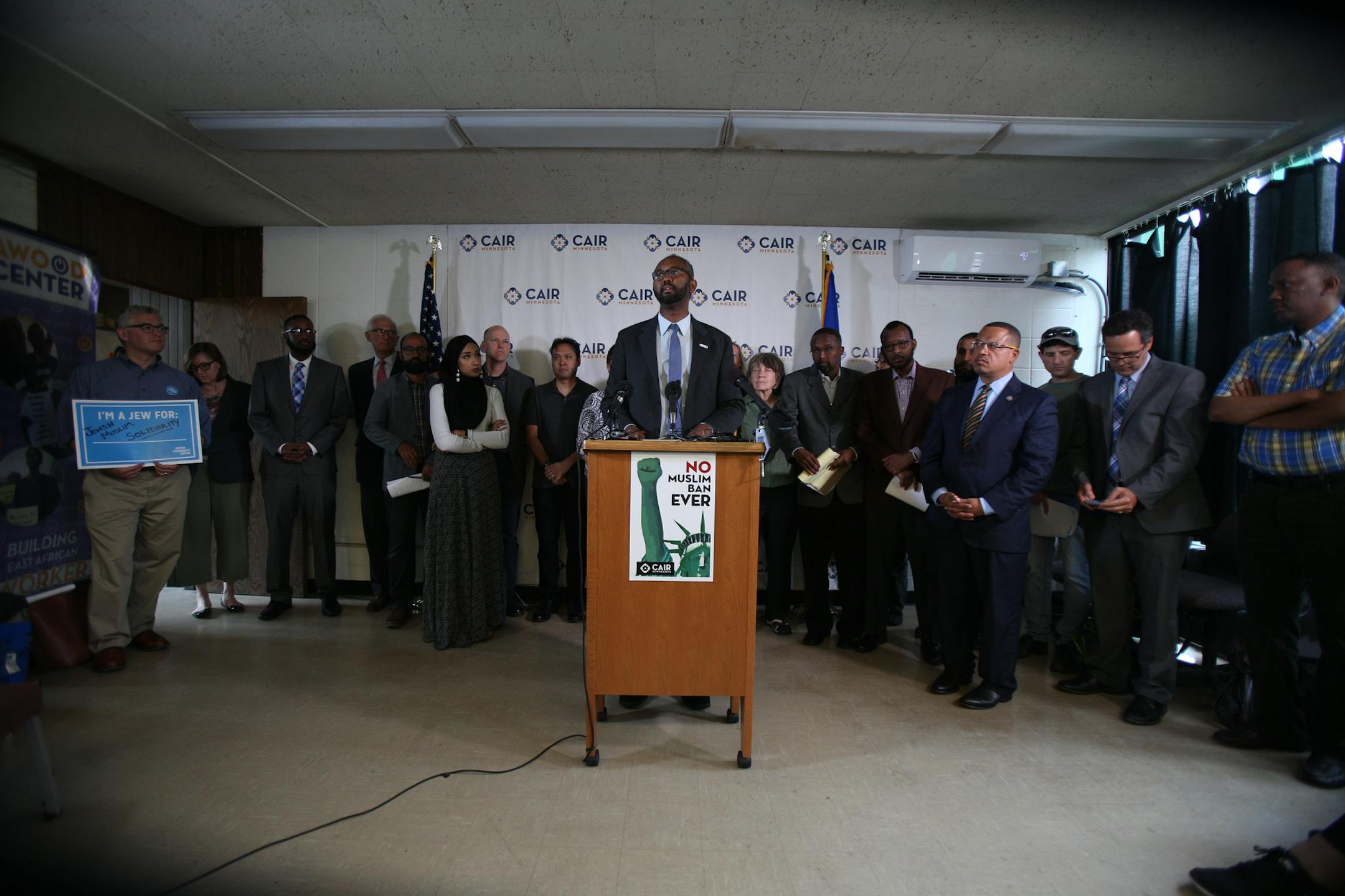 Jaylani Hussein, executive director of CAIR Minnesota, opened the press conference following the Supreme Court decision to uphold President Trump's travel ban. ] ALEX KORMANN • alex.kormann@startribune.com Two dozen people from different groups in Minnesota came together for a press conference hosted by CAIR on Tuesday following the Supreme Court decision to uphold President Trump's travel ban. Speakers included attorneys, professors of law from the University of Minnesota, Congressmen an