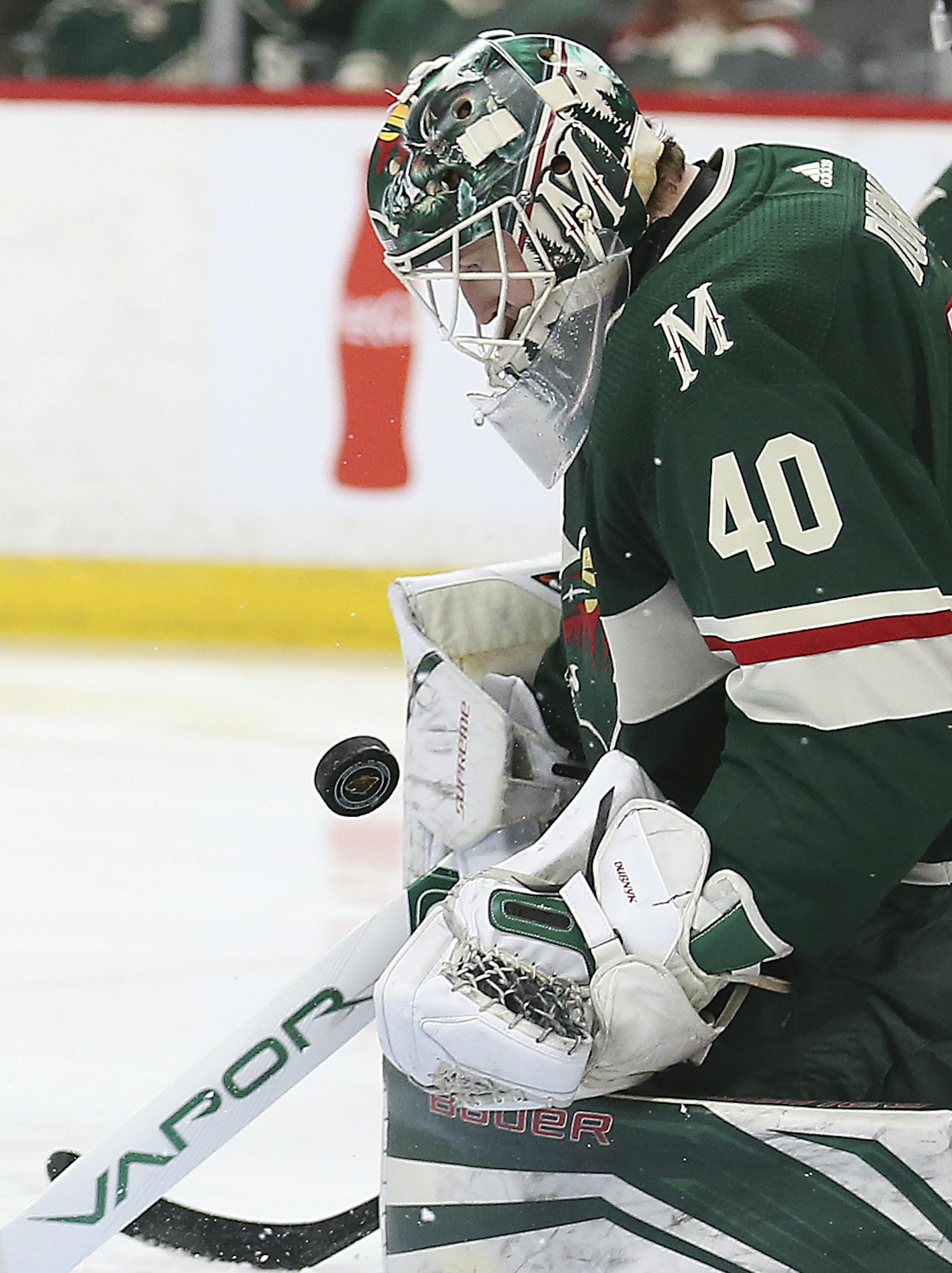 Minnesota Wild's goalie Devan Dubnyk (40) stops the puck from the Nashville Predators' in the second period of an NHL hockey game Saturday, March 24, 2018, in St. Paul, Minn. (AP Photo/Stacy Bengs)