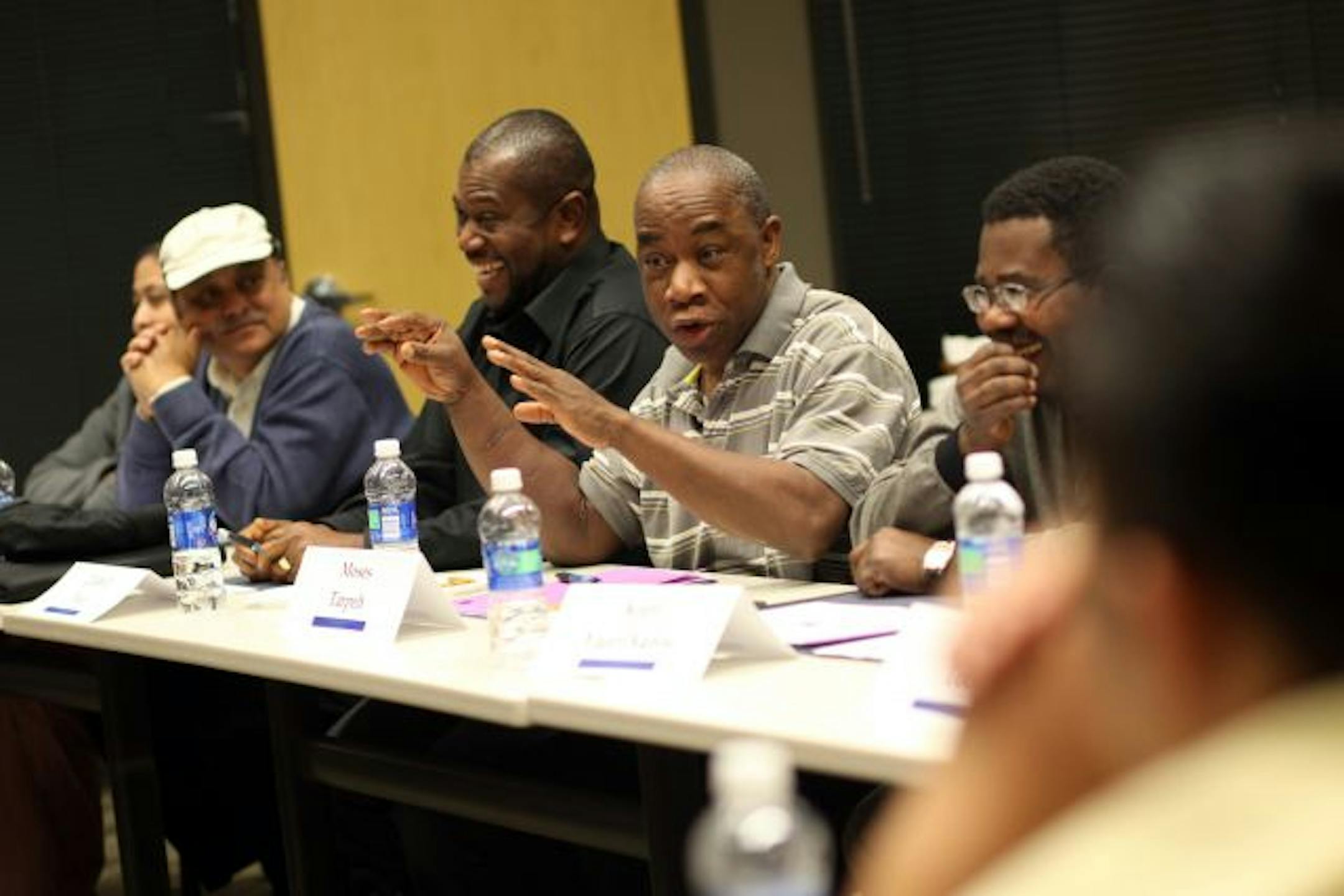 Moses Tarpeh (center, gesturing) shared a story with the class about his experience with law enforcement during a citizens academy in Brooklyn Park designed for new immigrants.