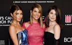 In this Feb. 28, 2019 file photo, actress Lori Loughlin, center, poses with daughters Olivia Jade Giannulli, left, and Isabella Rose Giannulli at the 