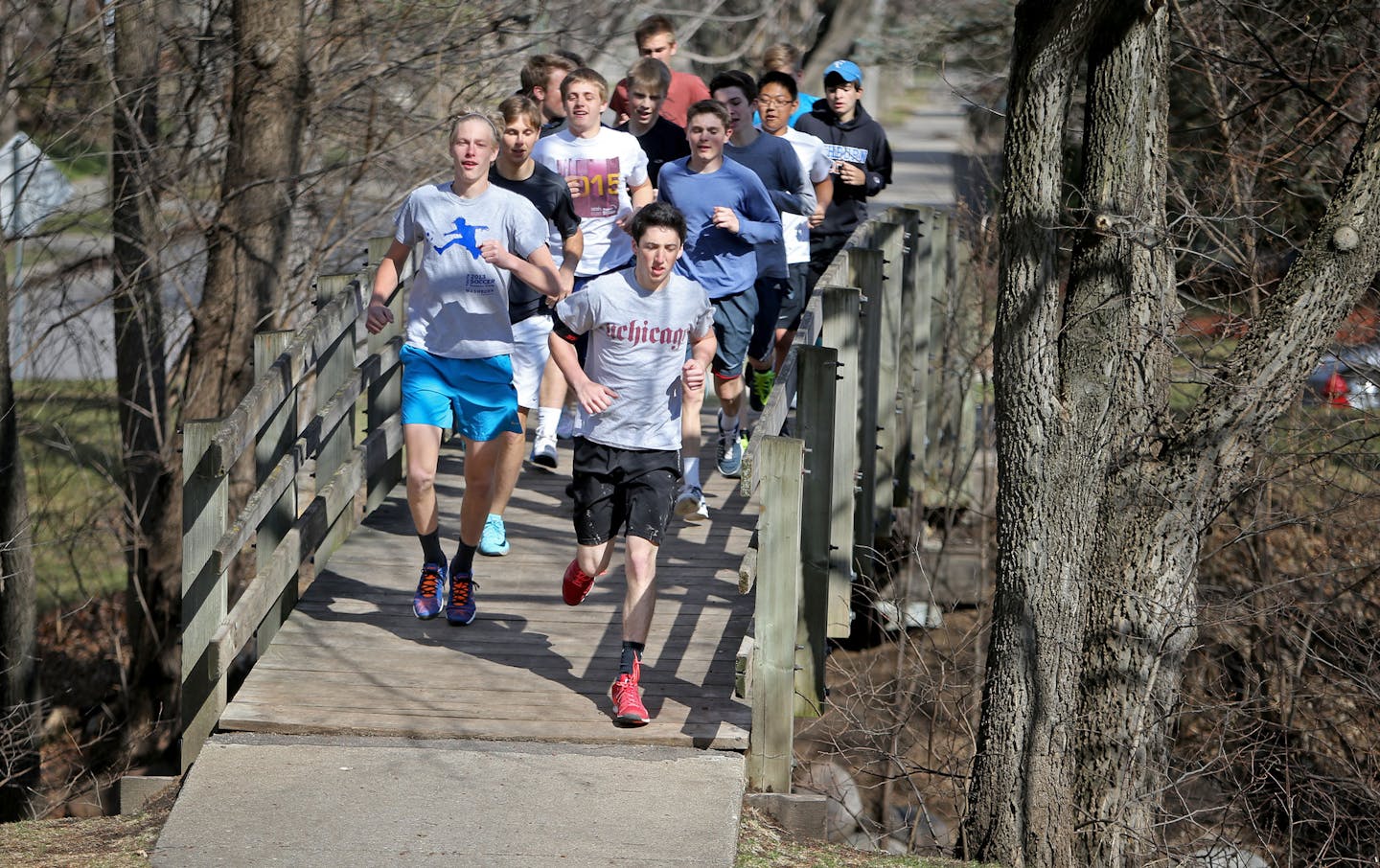 Former Washburn tennis player, NFL wide receiver and contestant on The Bachelorette, Ryan Hoag, has revived a boys' tennis program at Washburn that was almost dormant when he took over seven years ago. Here, Washburn team members begin practice with a warmup run at Morgan Park Friday, April 10, 2015, in Minneapolis, MN.](DAVID JOLES/STARTRIBINE)djoles@startribune.com Former Washburn tennis player, NFL wide receiver and contestant on The Bachelorette, Ryan Hoag, has revived a boys' tennis program