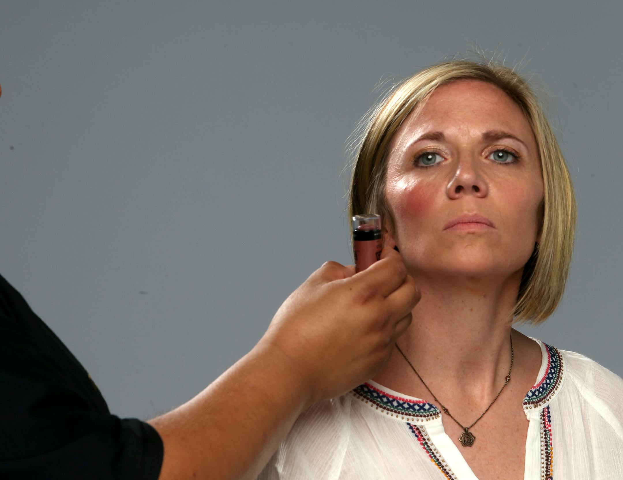 Mark Navarro works on Katie Jordan's cheeks. ] JOELKOYAMA‚Ä¢jkoyama@startribune Minneapolis, MN on June 10, 2014. Artist Mark Navarro is bringing the makeup and models and we'll photograph three segments.