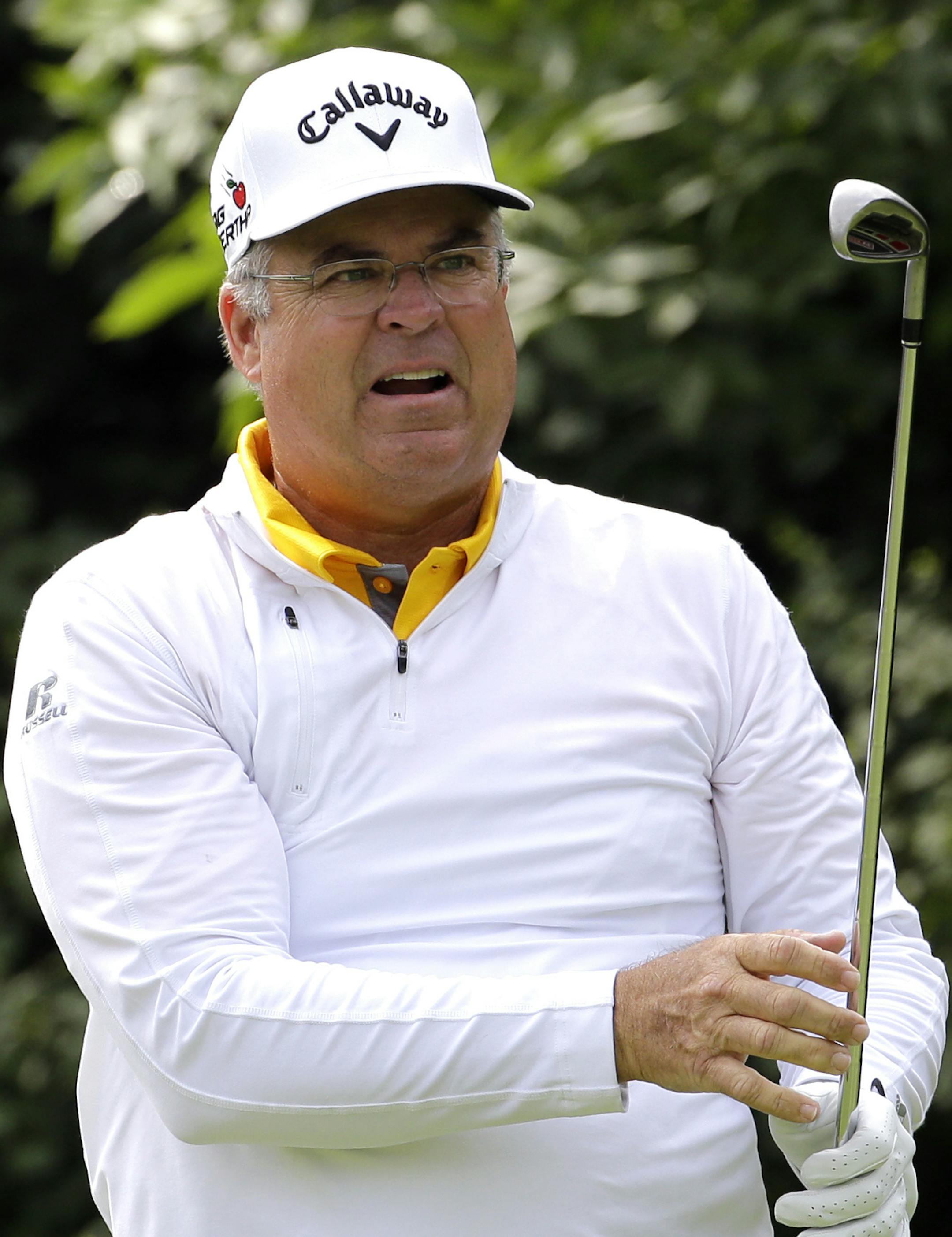 Kenny Perry reacts after hitting his tee shot on the 17th hole during the first round of the Encompass Championship golf tournament Friday, July 10, 2015, in Glenview, Ill. (AP Photo/Nam Y. Huh) ORG XMIT: ILNH113