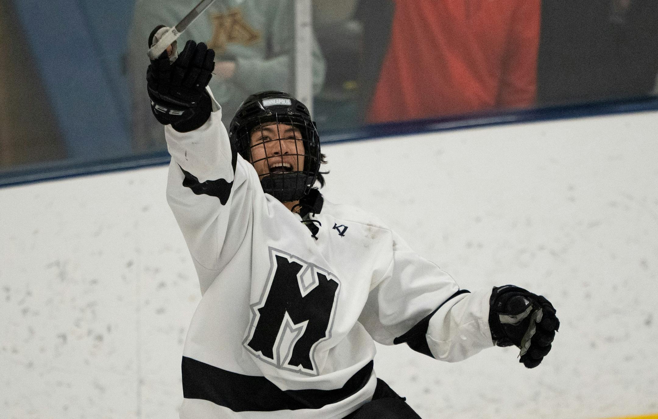 Minneapolis defenseman Leo Warner (20) tossed his stick in the air as he celebrated Minneapolis defeating Delano 3 - 1 to win the MSHSL Section 2A Boys Hockey Tournament Championship Wednesday night, March 2, 2022 at the St. Louis Park Rec Center and advance to the State Tournament. ] JEFF WHEELER • Jeff.Wheeler@startribune.com
