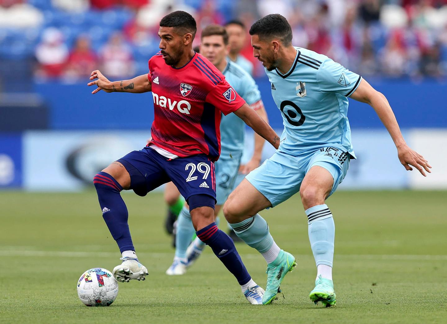 FC Dallas' Franco Jara (29) tries to go around Minnesota United defender Michael Boxall during the first half of an MLS soccer game, Sunday, May 22, 2022, in Frisco, Texas. (Steve Nurenberg/The Dallas Morning News via AP)