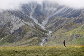 Ruby Tam, a visitor to Wonder Lake, took a short walk on a bluff trail when the Park bus made a rest stop for 20 minutes at Eielson Visitor Center. Lo