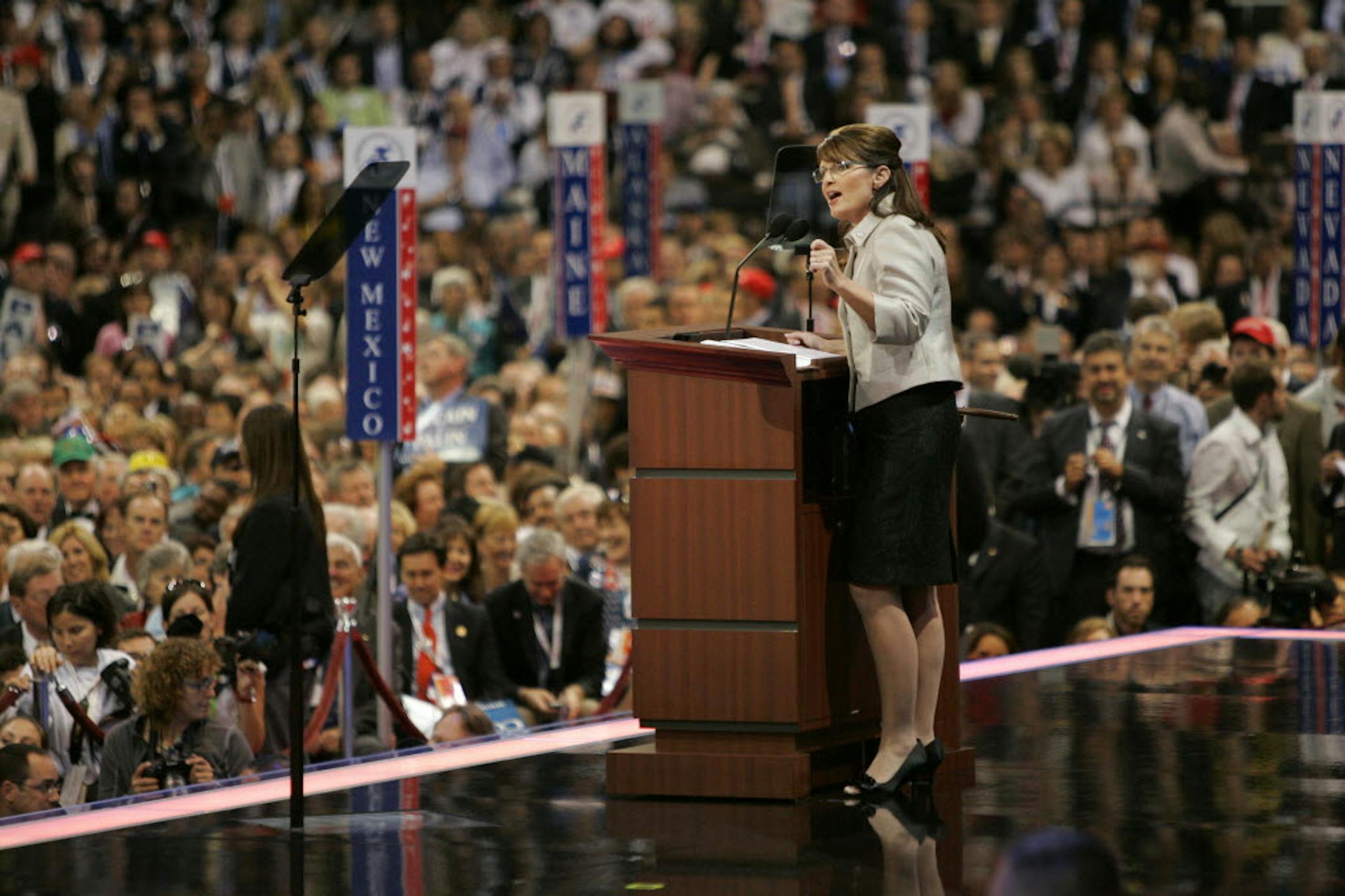 Minnesotans in the convention hall gave Sarah Palin a strong thumbs up, waving signs and chanting "Sar-ah," some standing on their chairs.