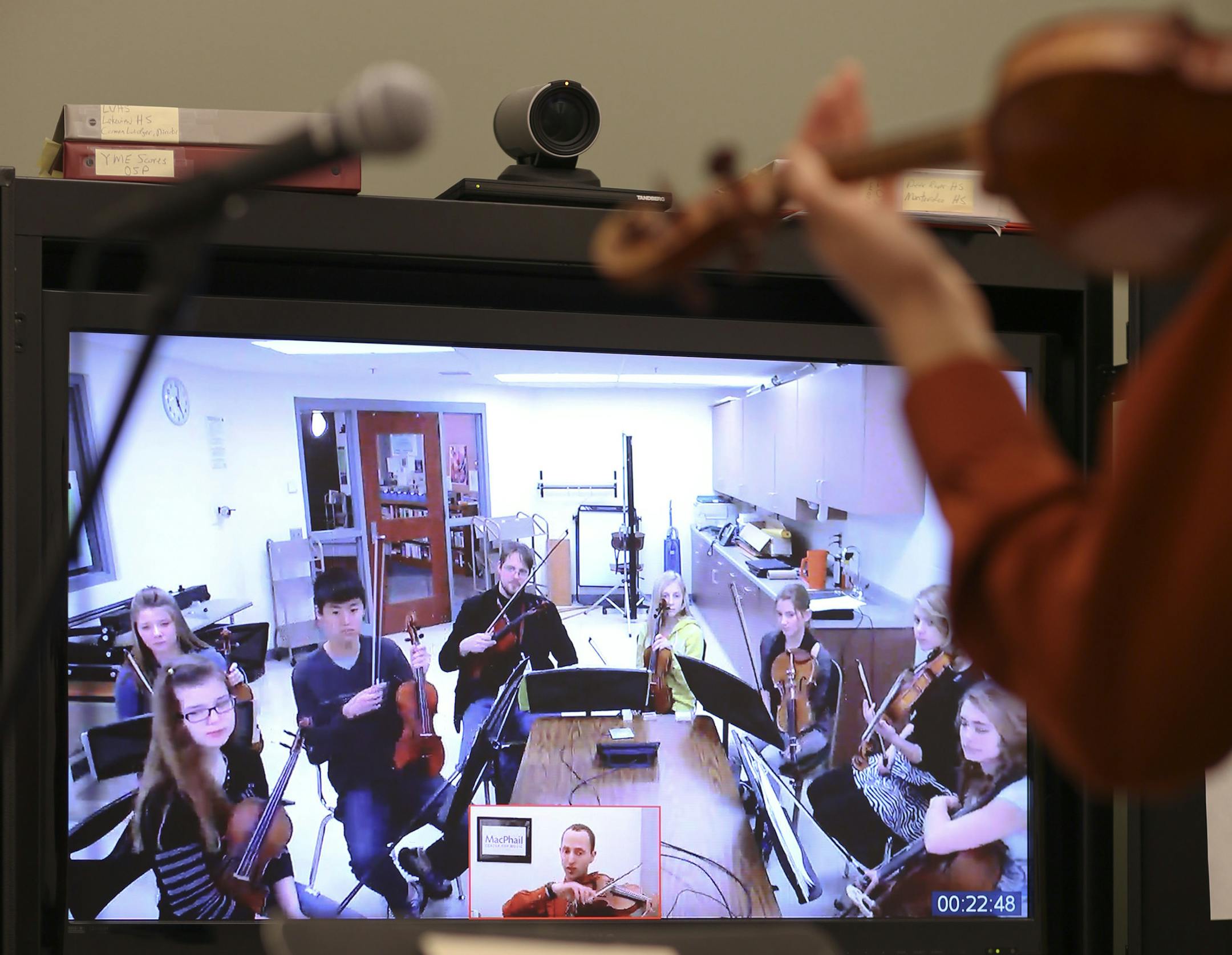 Jeremy Swider is not a time traveller. But when the music instructor worked with high school students in the Itasca Orchestra and Strings Program in Grand Rapids this week, he was 175 miles away from them. Swider is participating in an experiment that brings professional musicians at the MacPhail Center for Music to the classrooms of smaller, outstate schools through video conferencing. Launched in 2011 to help cash-strapped rural schools boost their music programs, it's grown from 500 students