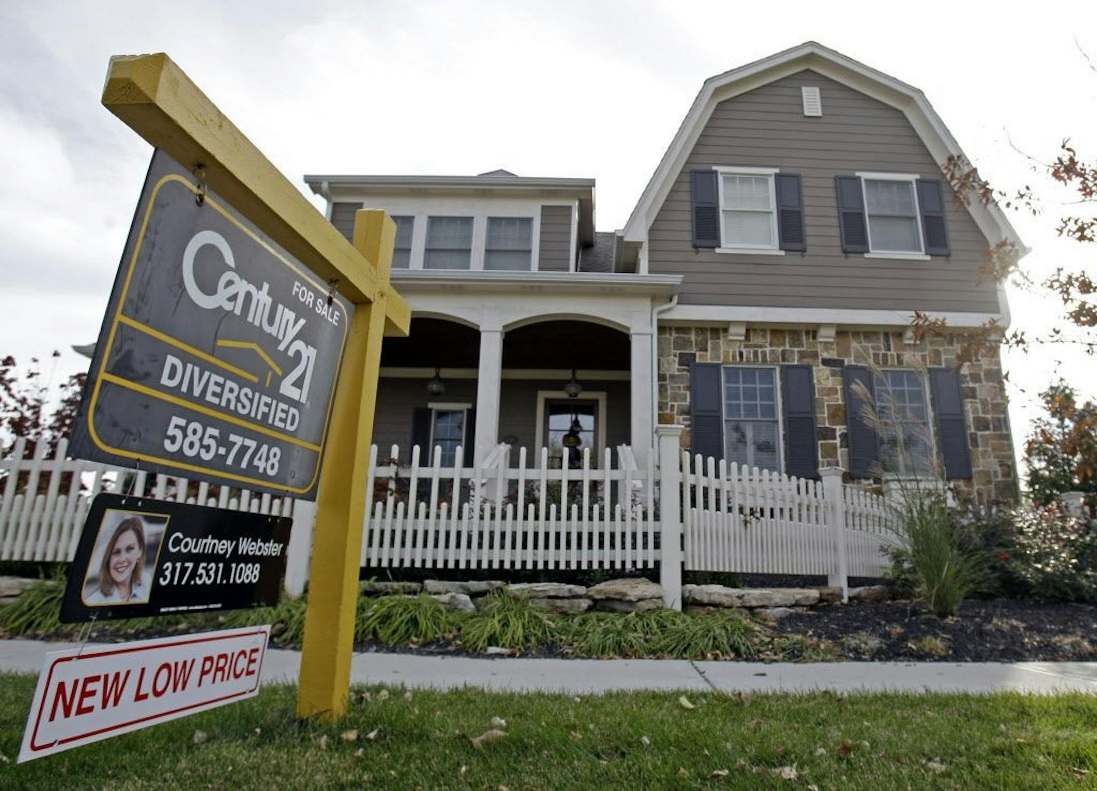 FILE - This Oct. 20, 2009, file photo, shows a home with a reduced price for sale in Carmel, Ind., neighborhood. Short of cash and unsettled in their careers, young Americans are waiting longer than ever to buy their first homes. The delay reflects a trend that cuts to the heart of the financial challenges facing millennials: Renters are struggling to save for down payments.
