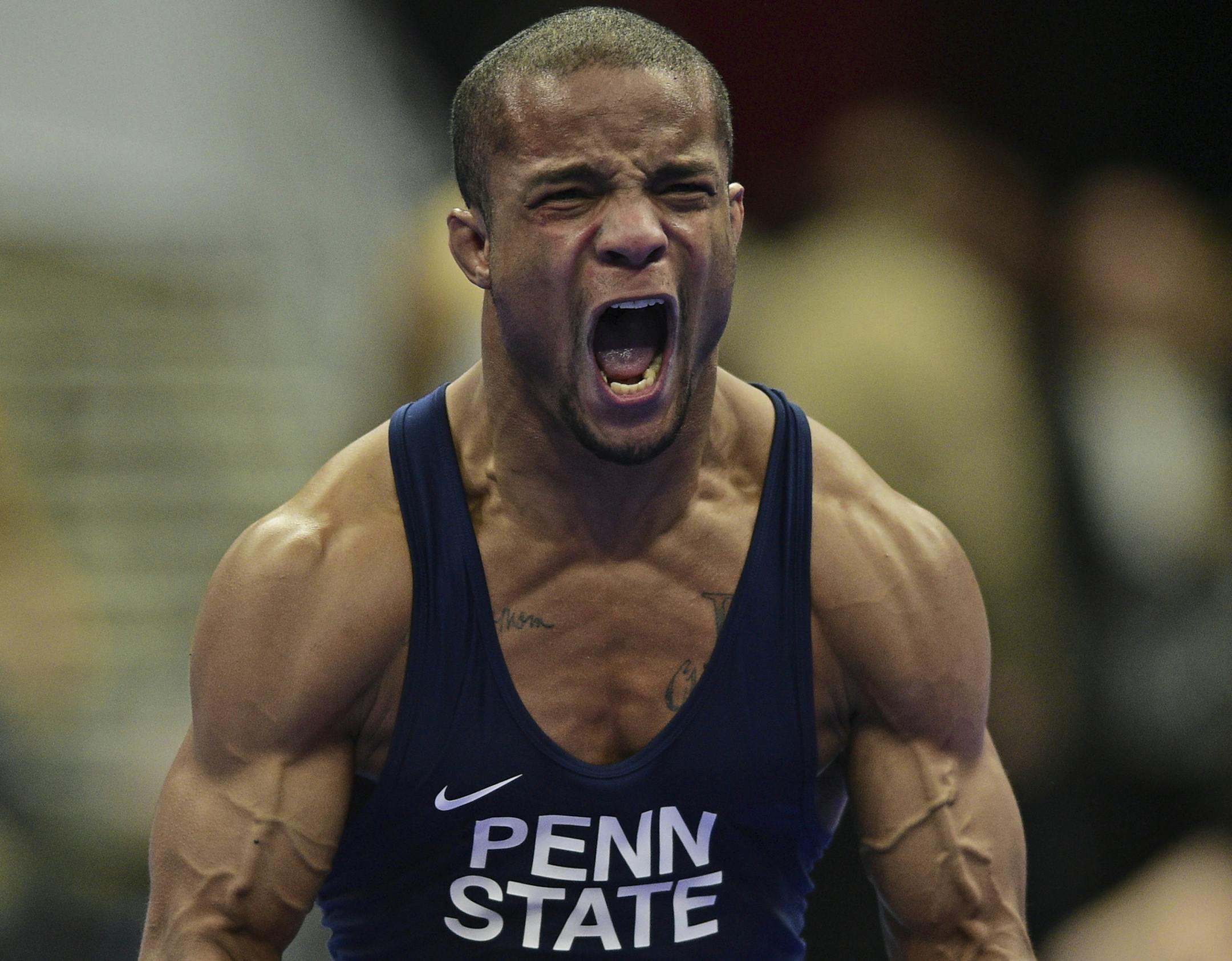 Penn State's Mark Hall celebrates after defeating Missouri's Daniel Lewis in a bout at 174 pounds during the NCAA Division I wrestling championships Friday, March 16, 2018, in Cleveland. (AP Photo/David Dermer) ORG XMIT: OHDD117