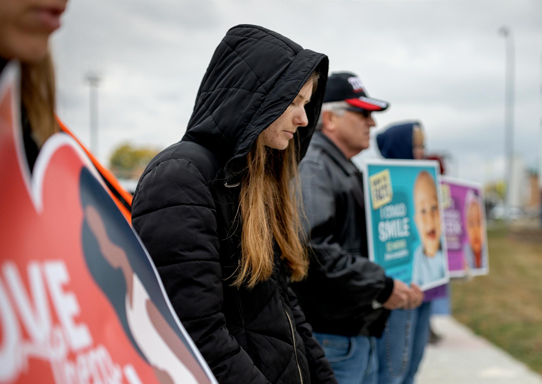Abortion opponents prayed outside the Red River Women's Clinic in Moorhead.