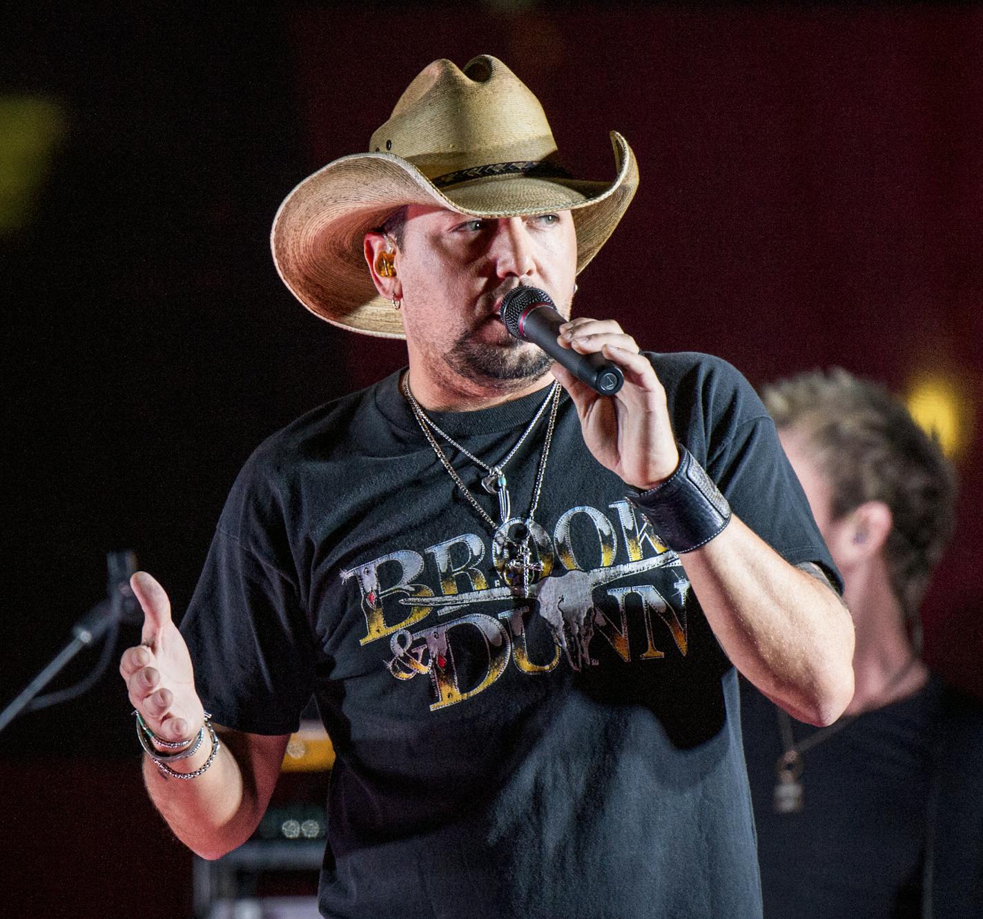 FILE - In this June 7, 2017 file photo Jason Aldean performs during a surprise pop up concert at the Music City Center in Nashville, Tenn. &#x201c;Saturday Night Live&#x201d; has paid tribute to the victims of the Las Vegas mass shooting and the late rock superstar Tom Petty by opening its show with country star Aldean singing one of Petty&#x2019;s songs. Aldean was performing at an outdoor concert in Las Vegas on Sunday, Oct. 1, 2017, when a gunman sprayed bullets into the crowd from a high-ris