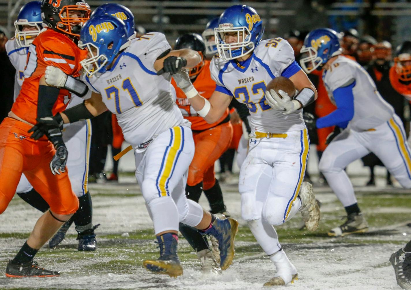 Waseca running back Joe Hagen takes the ball on a sweep against Winona. Hagen had three rushing touchdowns in the first half for the Bluejays. Photo by Jeff Lawler, SportsEngine