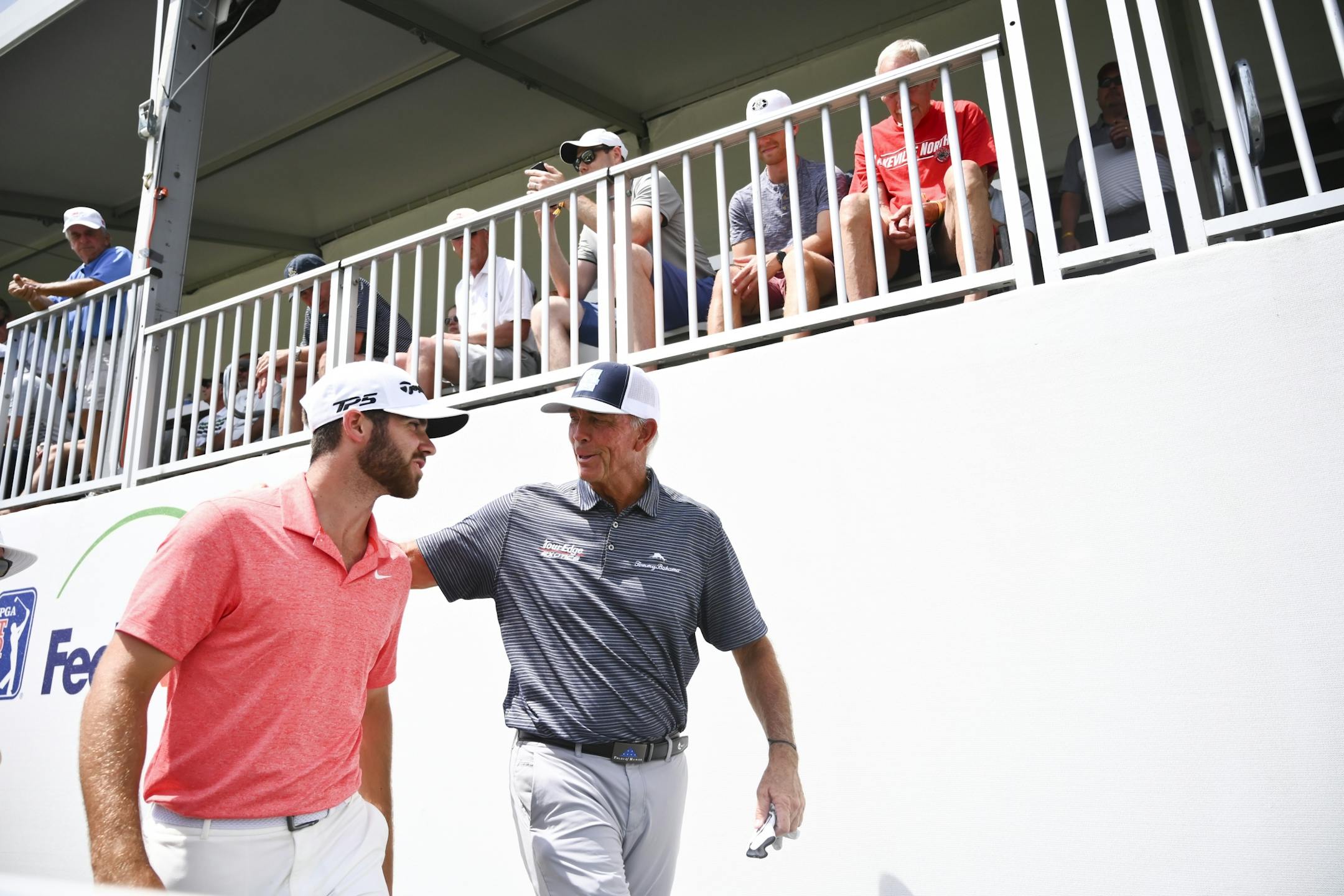 Tom Lehman put his arms around Matthew Wolff as the two walked back toward the clubhouse after finishing the third round of the 3M Open Saturday.