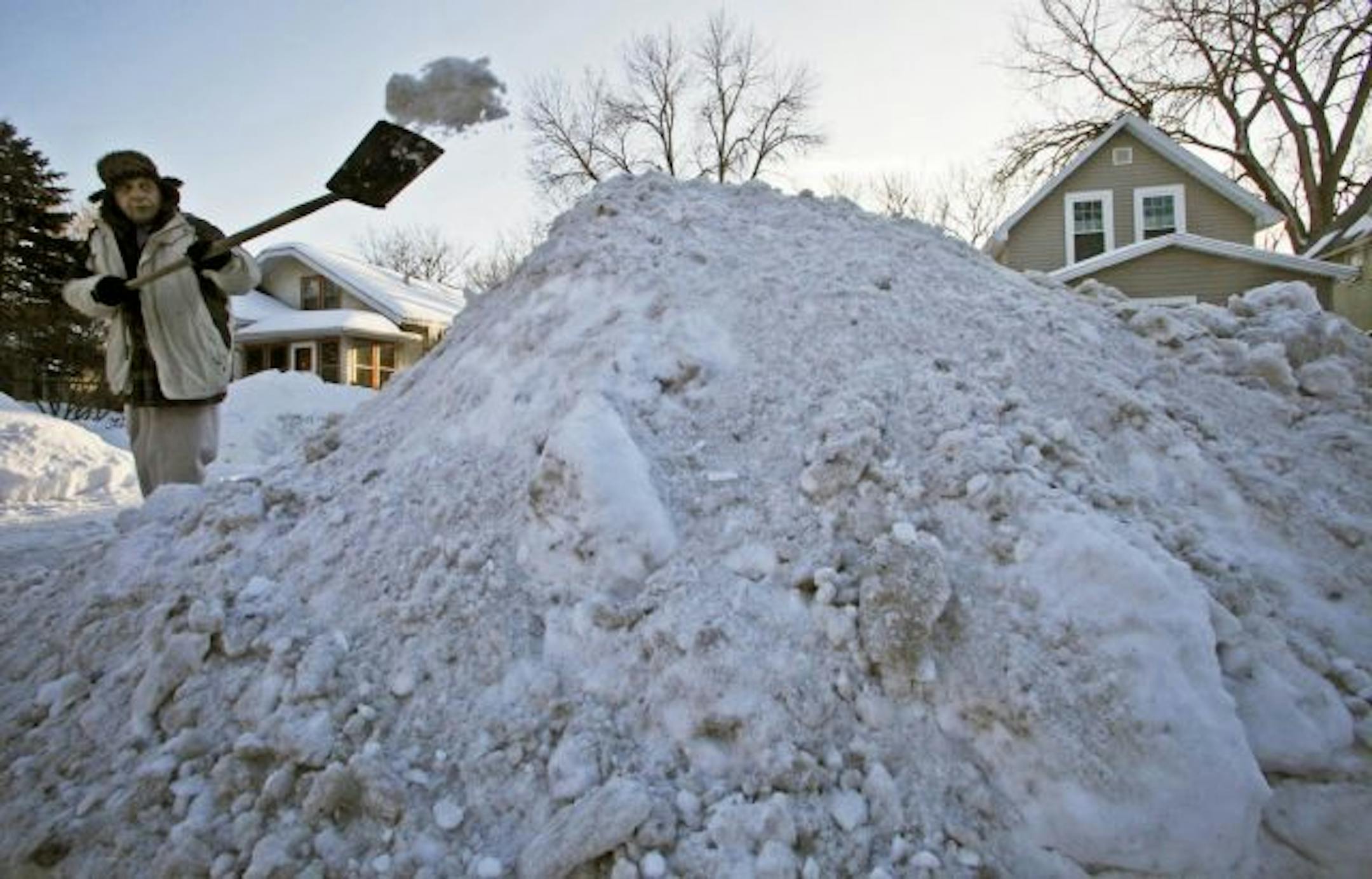 Steve Matz shoveled out the driveway at his Minneapolis home. Officials and homeowners are running out of room to put the snow, which has piled up since early December.