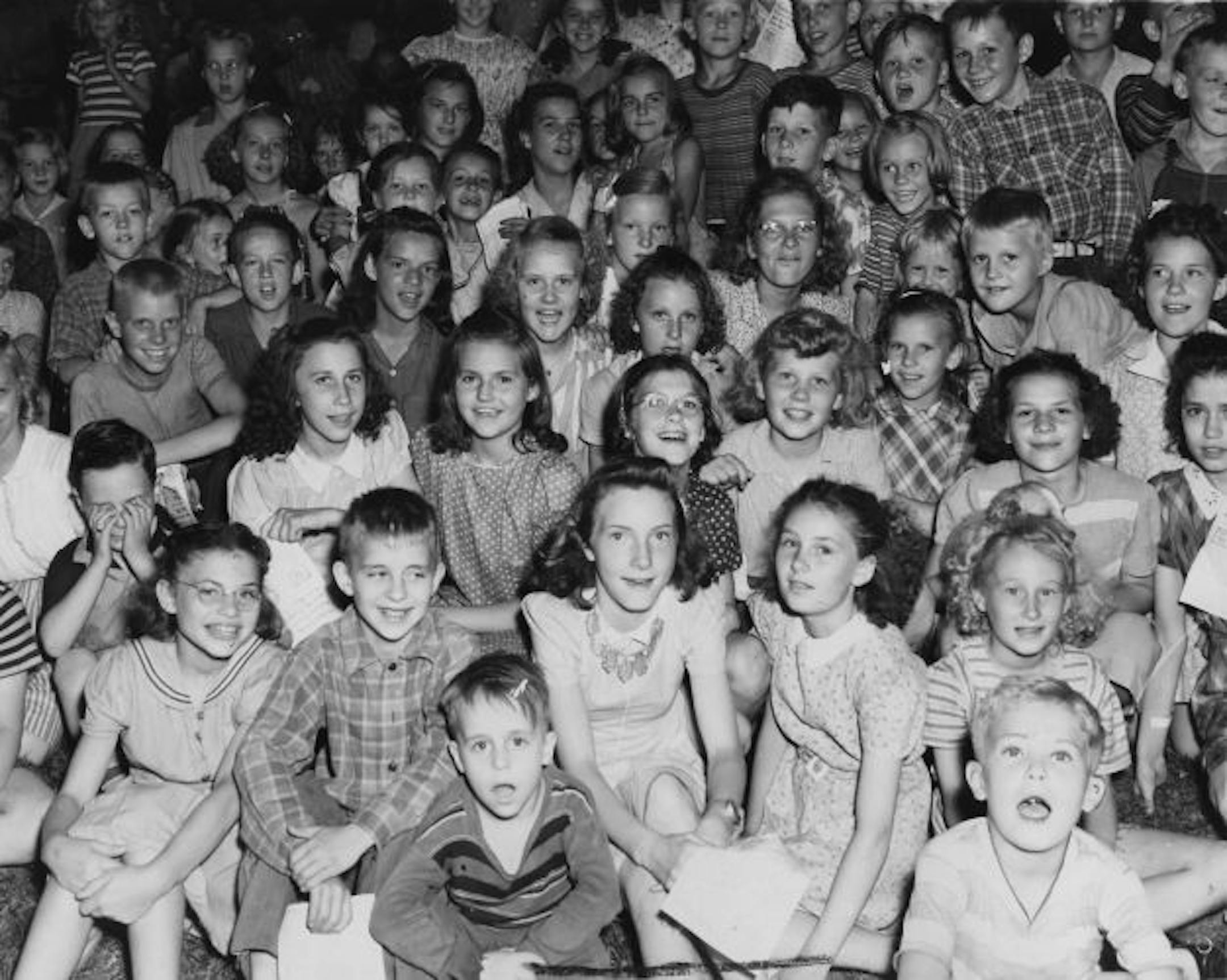 Children taking part in a community sing at Riverside Park in 1943.
