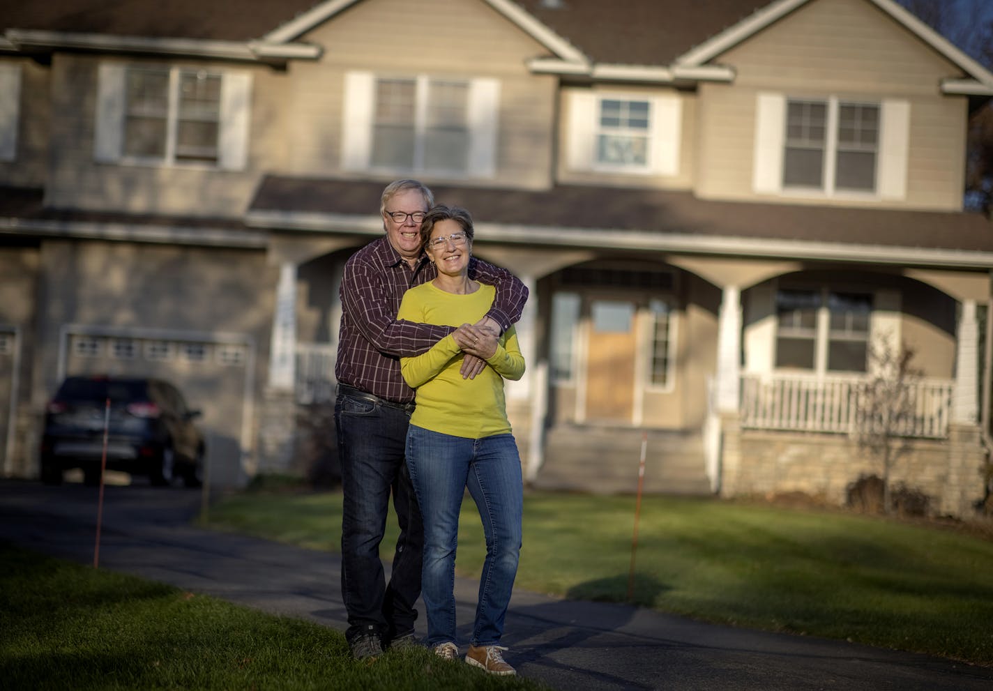 Kathy and Doug Dunmire volunteered to host homeless youth in their Inver Grove Heights home as part of a new Dakota County program with the YMCA. Starting in July, they have hosted a 24- and 21-year-olds in their spare bedroom, sharing dinner and taking them on mini vacations like sailing in Wisconsin. Here, they were photographed in front of their home, Thursday, November 5, 2020 in Inver Grove Heights, MN. ] ELIZABETH FLORES • liz.flores@startribune.com