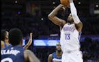 Oklahoma City Thunder forward Paul George (13) shoots against the Minnesota Timberwolves during the second quarter of an NBA basketball game in Oklaho
