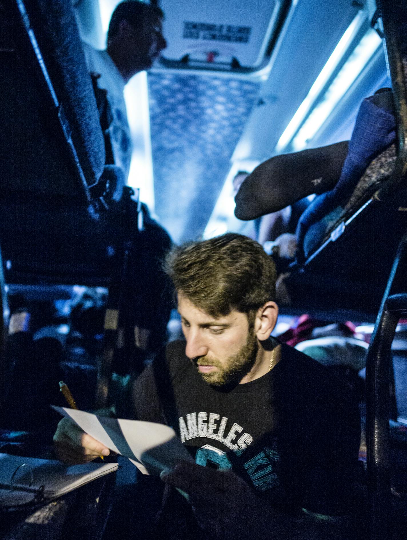 Sean Aronson catches up on his notes on the team bus heading out to Ottawa to play the Champions.] At CHS Field in St. Paul in a game between the Saint Paul Saints and Ottawa Champions Richard Tsong-Taatarii/rtsong-taatarii@startribune.com