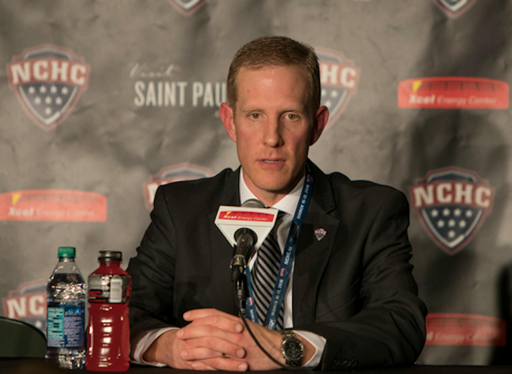 NCHC Commissioner Josh Fenton addresses the media before the 2018 NCHC Frozen Faceoff championship game. [ Special to Star Tribune, photo by Matt Blewett, Matte B Photography, matt@mattebphoto.com, St. Cloud State Huskies, Denver Pioneers, NCHC Frozen Faceoff, Xcel Energy Center, March 17, 2018, Minnesota, SAXO 1005687494 NCHC031718