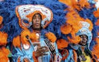 Members of the Black Feathers and Wild Tchoupitoulas Mardi Gras Indians perform at the New Orleans Jazz and Heritage Festival on Friday, May 3, 2019, 