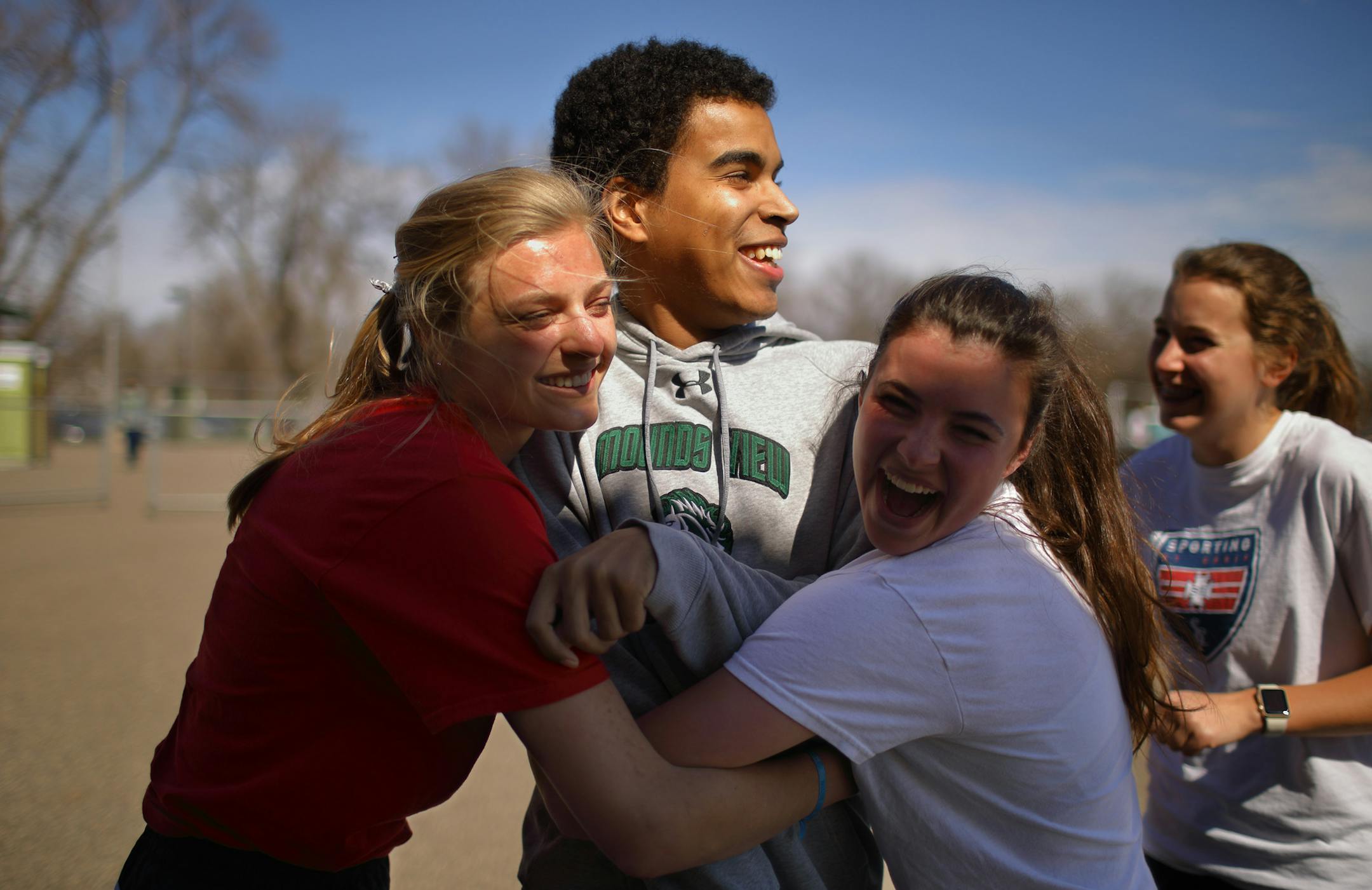 Charlie Etuko was greeted with hugs from Erin Saemrow, Briana Cline and Lucia Ranallo (Jeff Wheeler, Star tribune)