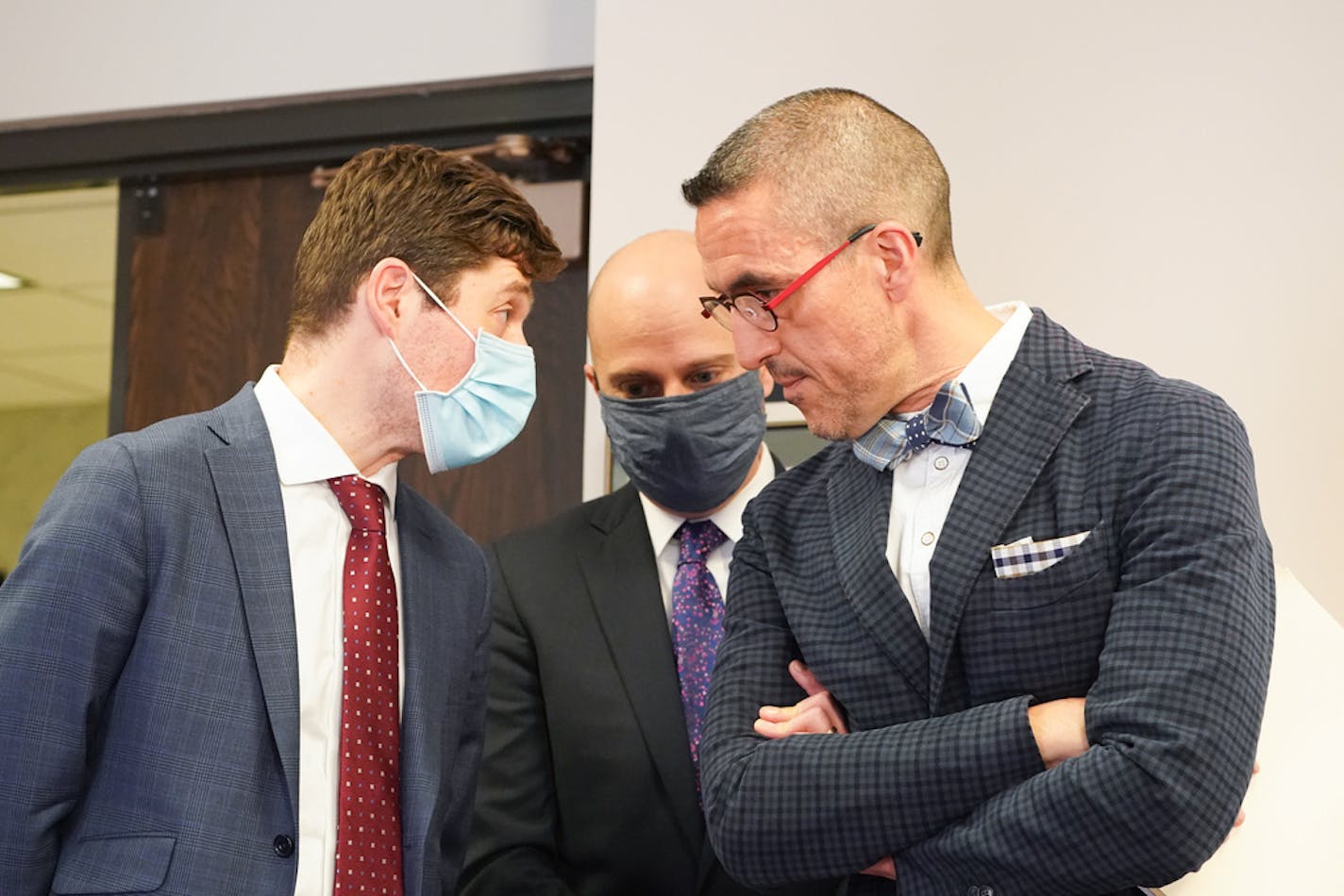 Minneapolis Mayor Jacob Frey talked with City Attorney Jim Rowader, and Assistant City Attorney Brian Carter, center, Rowader would say very little about the settlement. "To date I would say it hasn't had that impact," Rowader said. "With regard to timing, in general, there is not good timing to settle any case, particularly one as complex and involved and sensitive as this. There's no guarantee, for instance, that that deal would be available two, four, six, eight weeks from now."