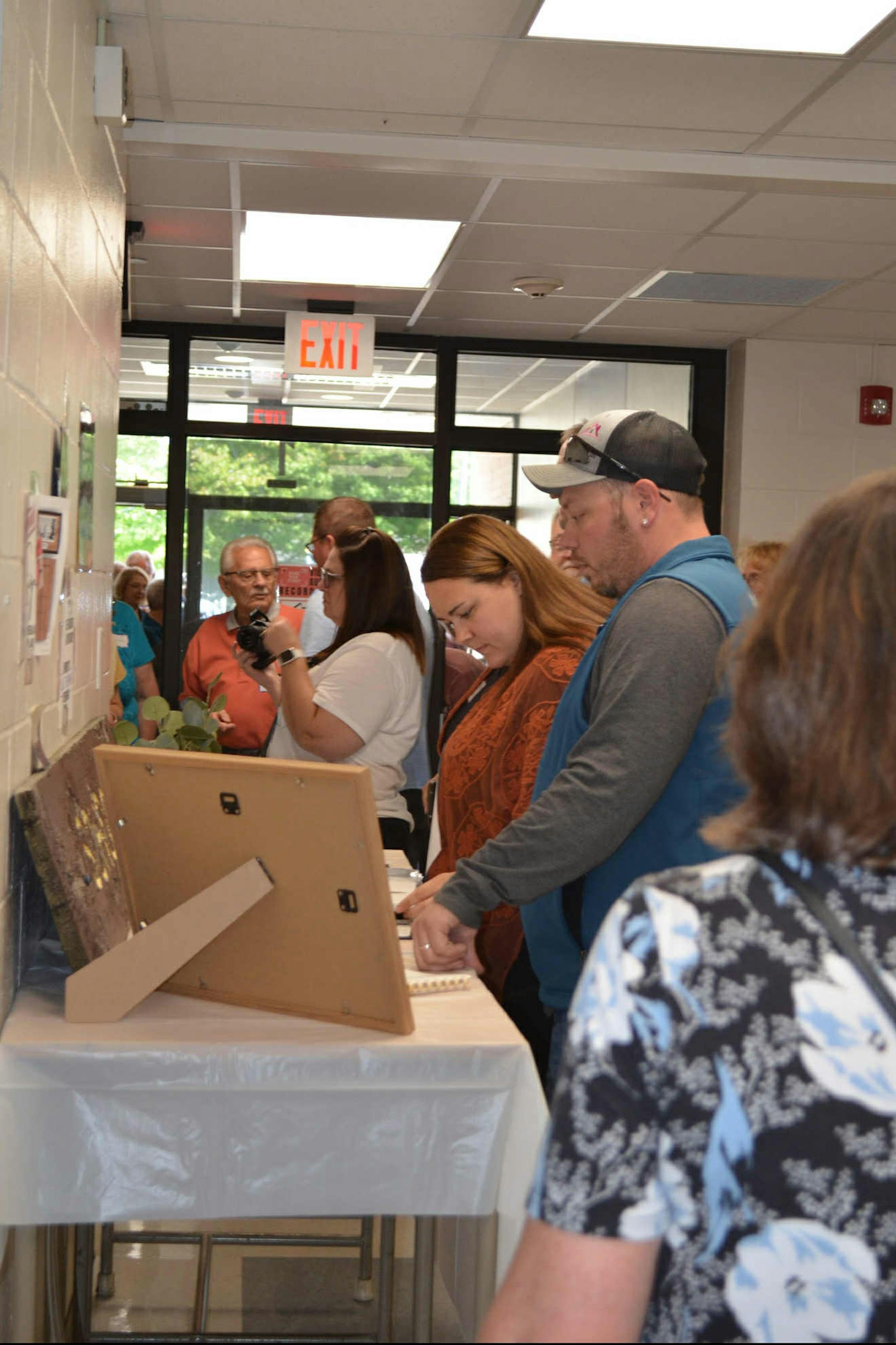 Community members look at memorabilia during the “Lasting Legacy for Dr. S.G. Knight” event on Sept. 28, 2025 in Randall, Minn.